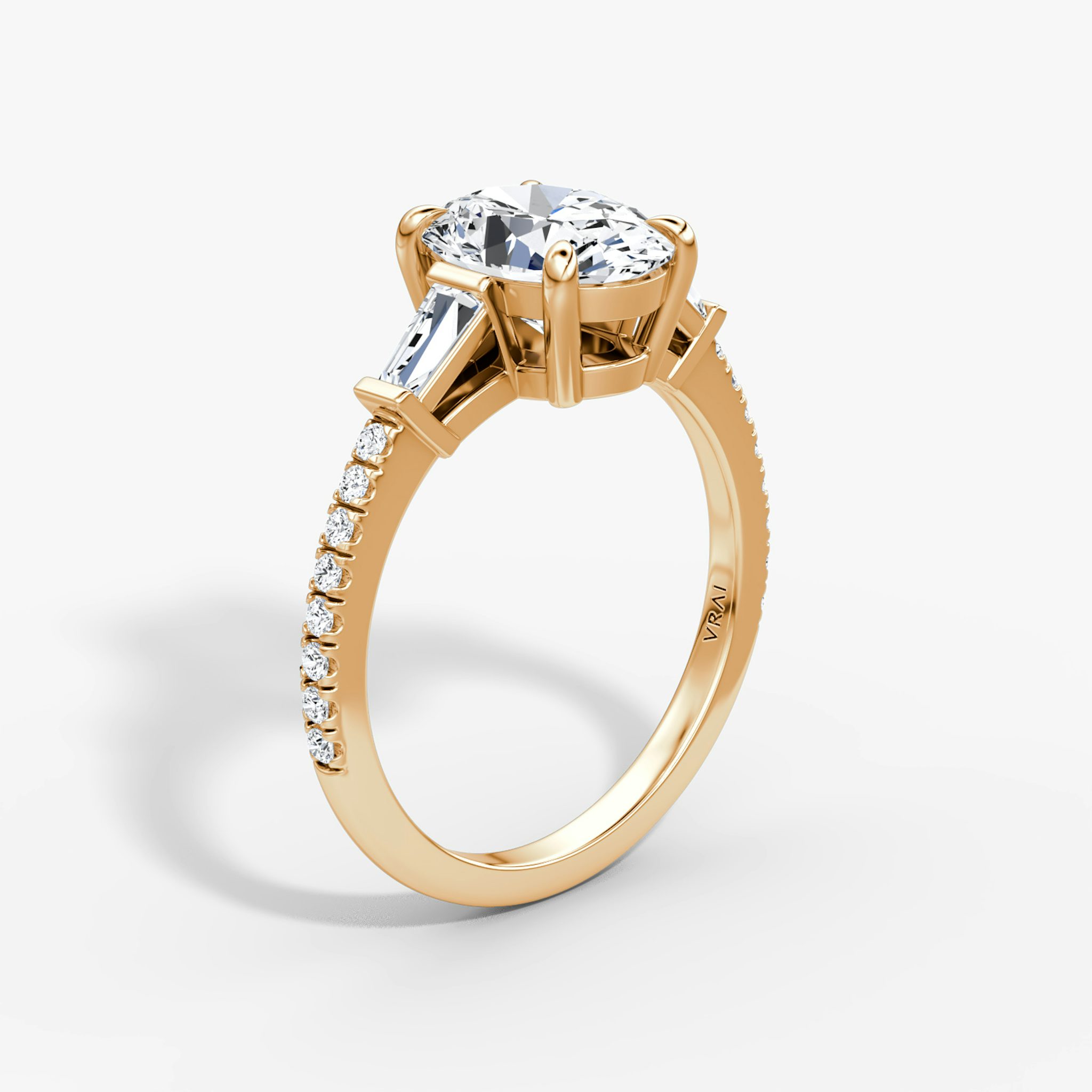 The Tapered Baguette Three Stone | Oval | 14k | Rose Gold | bandAccent: Pavé | excludeFromFeed: null | diamondOrientation: vertical | caratWeight: other
