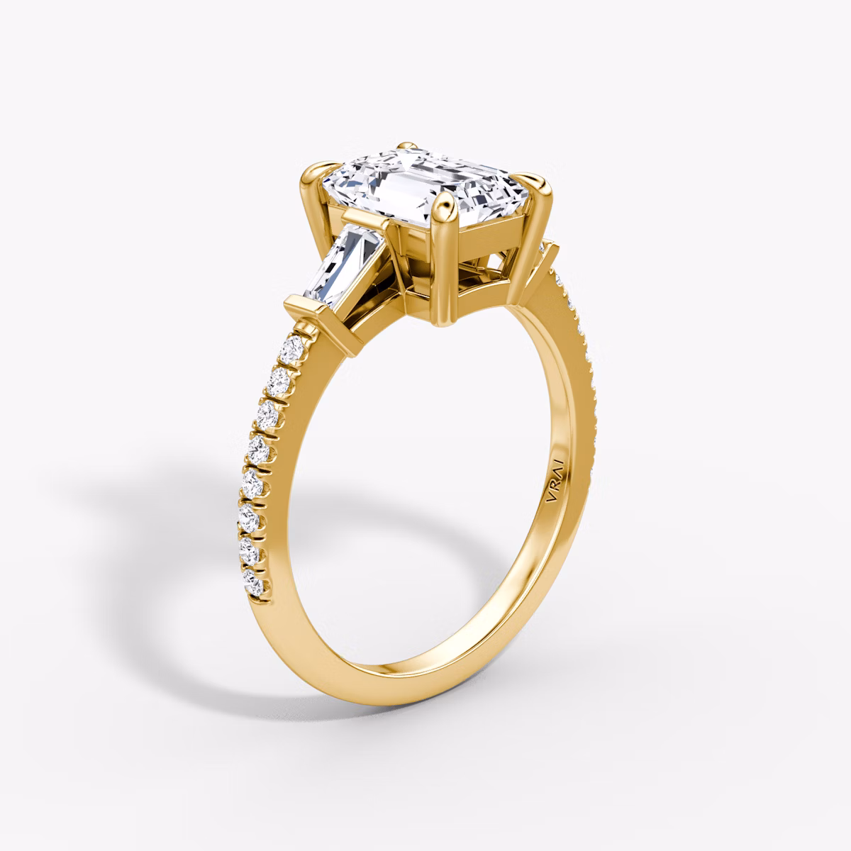The Tapered Baguette Three Stone | Emerald | 18k | Yellow Gold | bandAccent: Pavé | caratWeight: 1.0ct | excludeFromFeed: null | diamondOrientation: vertical