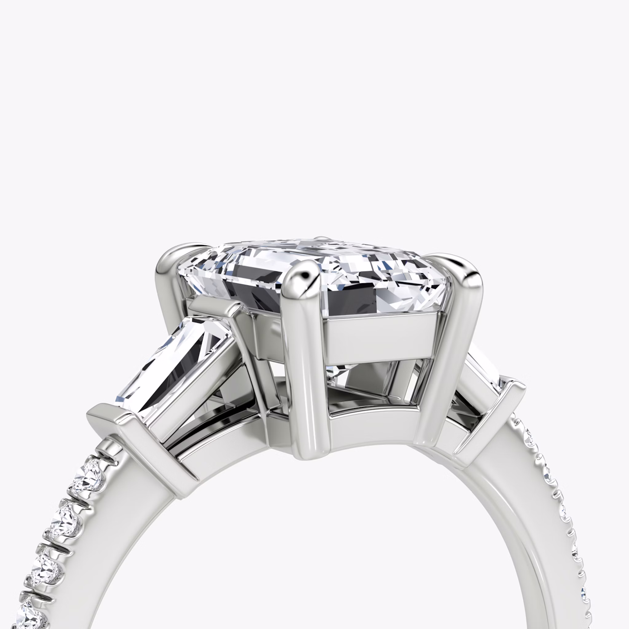 The Tapered Baguette Three Stone | Emerald | Platinum | bandAccent: Pavé | excludeFromFeed: null | diamondOrientation: vertical | caratWeight: other