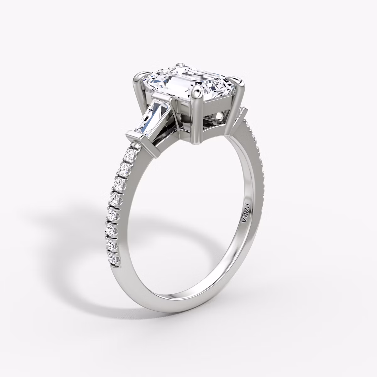 The Tapered Baguette Three Stone | Emerald | 18k | White Gold | bandAccent: Pavé | caratWeight: 1.0ct | excludeFromFeed: null | diamondOrientation: vertical