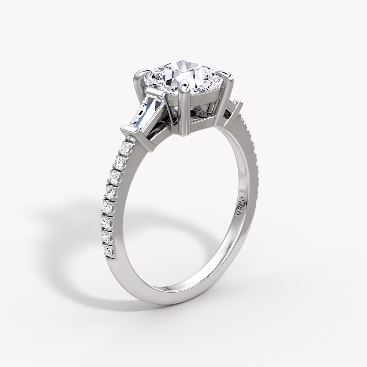 The Tapered Baguette Three Stone | Cushion | Platinum | bandAccent: Pavé | caratWeight: 1.0ct | excludeFromFeed: null | diamondOrientation: vertical