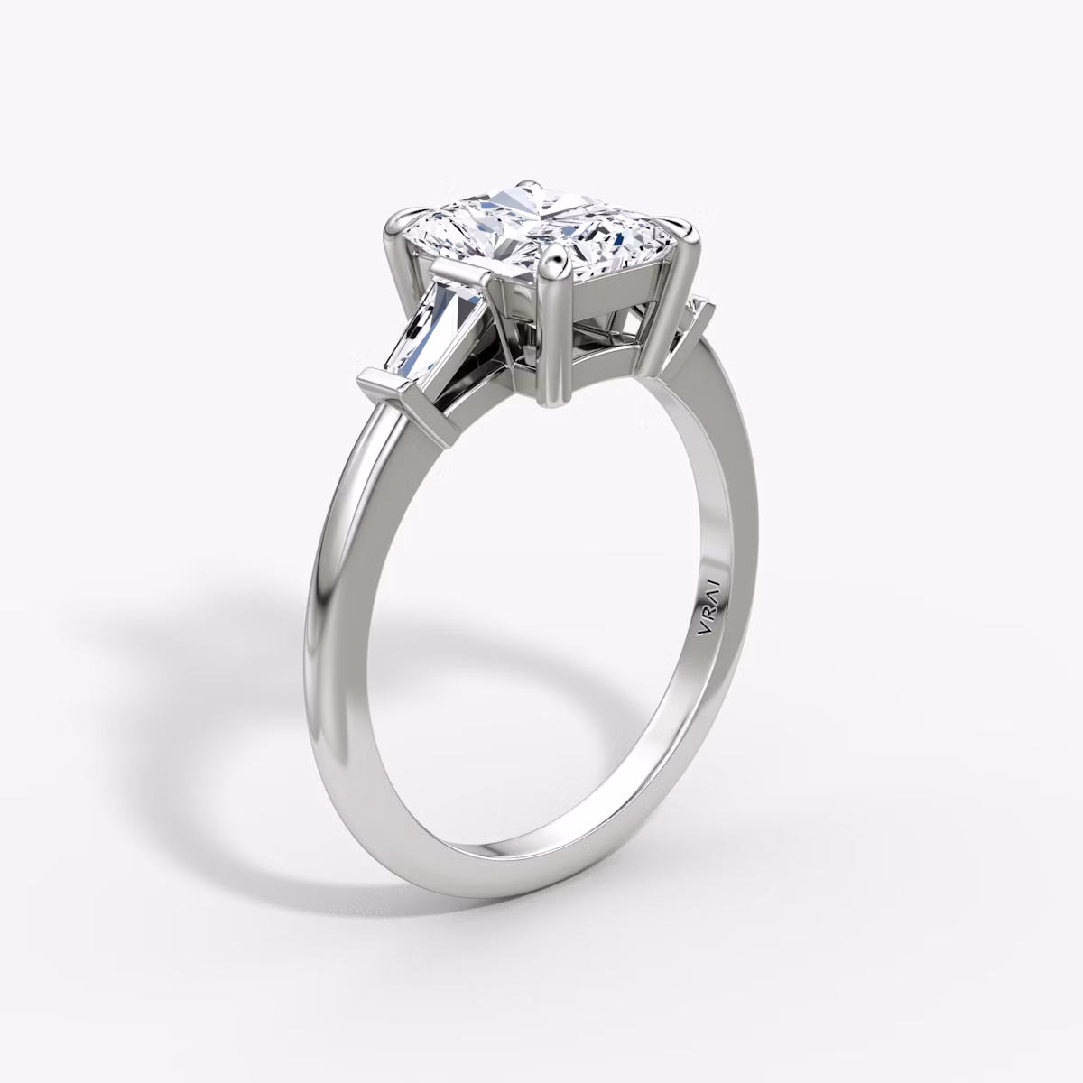 The Tapered Baguette Three Stone | Radiant | Platinum | bandAccent: Plain | caratWeight: 1.0ct | excludeFromFeed: null | diamondOrientation: vertical