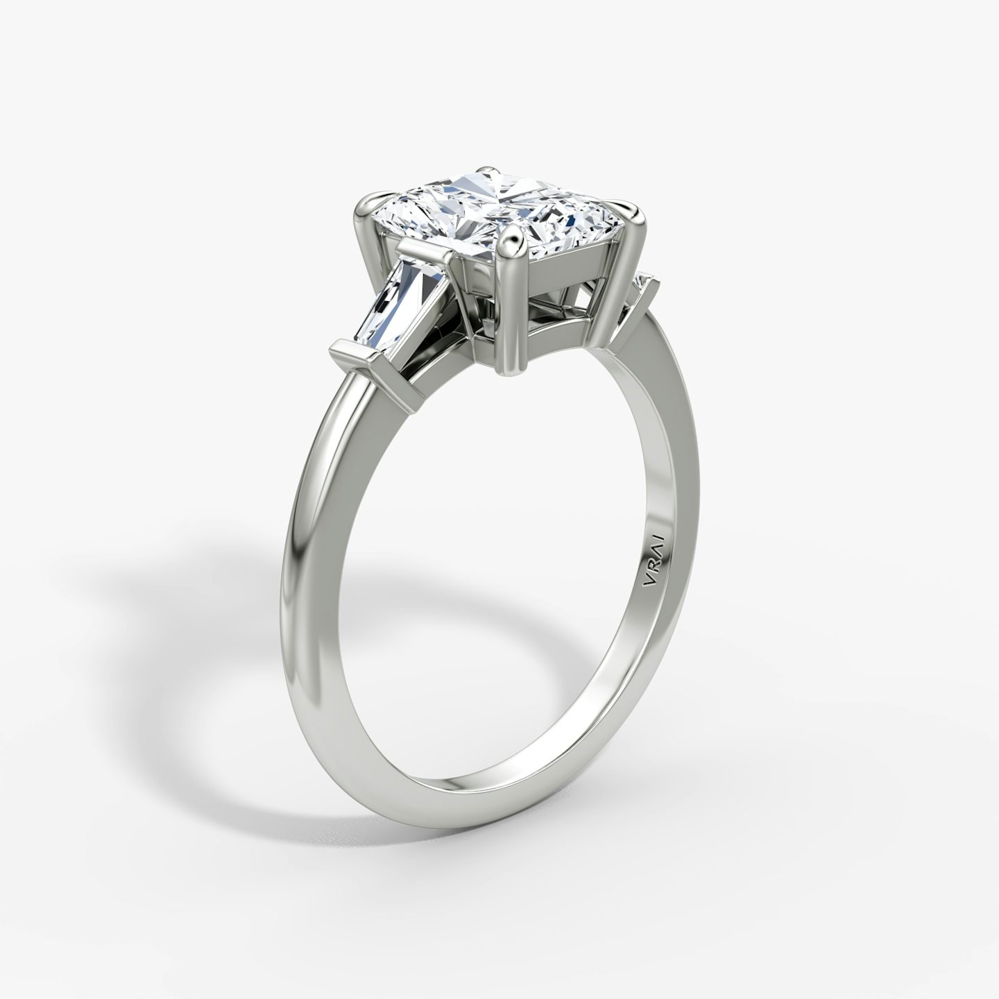 The Tapered Baguette Three Stone | Radiant | 18k | White Gold | bandAccent: Plain | excludeFromFeed: null | diamondOrientation: vertical | caratWeight: other