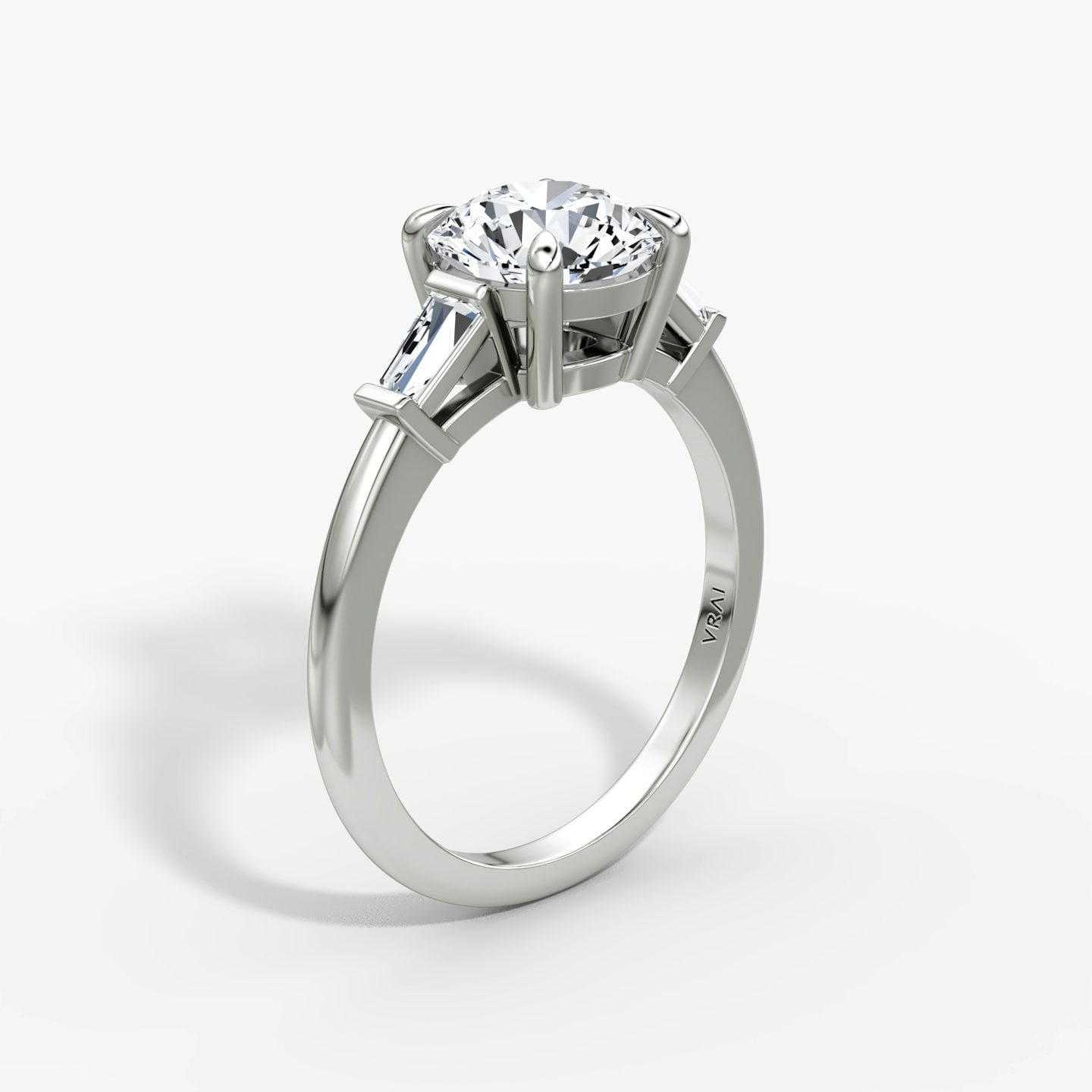 The Tapered Baguette Three Stone | Round Brilliant | Platinum | bandAccent: Plain | caratWeight: 1.5ct | excludeFromFeed: null | diamondOrientation: vertical