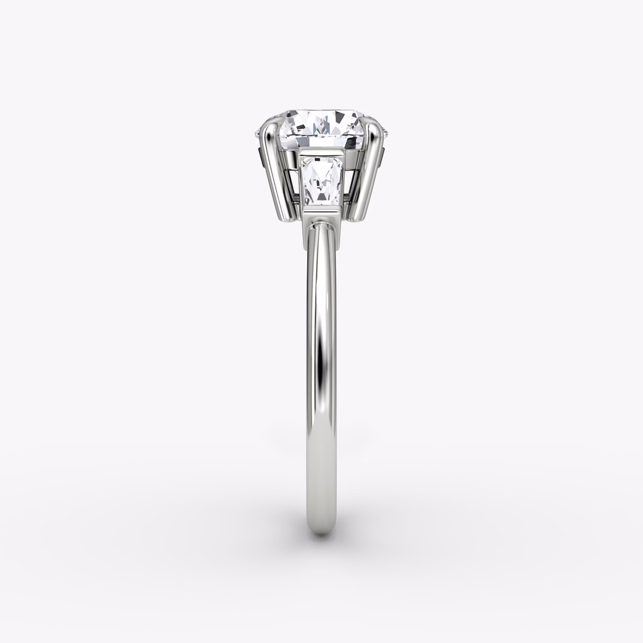 The Tapered Baguette Three Stone | Round Brilliant | 18k | White Gold | bandAccent: Plain | caratWeight: other | excludeFromFeed: null | diamondOrientation: vertical