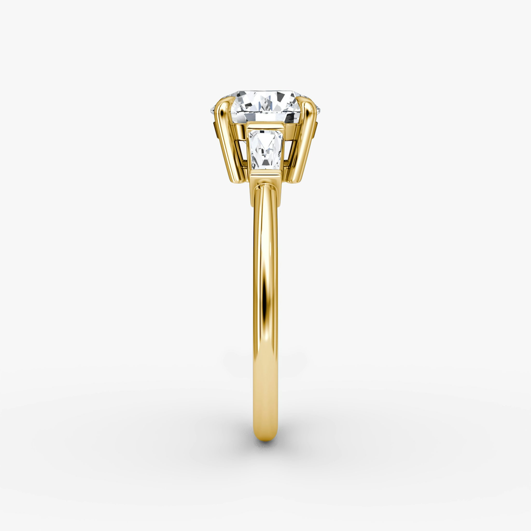 The Tapered Baguette Three Stone | Round Brilliant | 18k | Yellow Gold | bandAccent: Plain | caratWeight: 1.5ct | excludeFromFeed: null | diamondOrientation: vertical