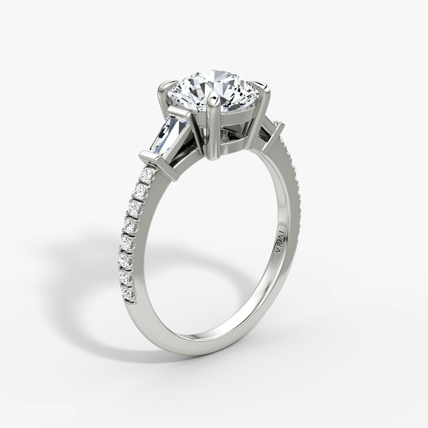 The Tapered Baguette Three Stone | Round Brilliant | Platinum | bandAccent: Pavé | caratWeight: other | excludeFromFeed: null | diamondOrientation: vertical