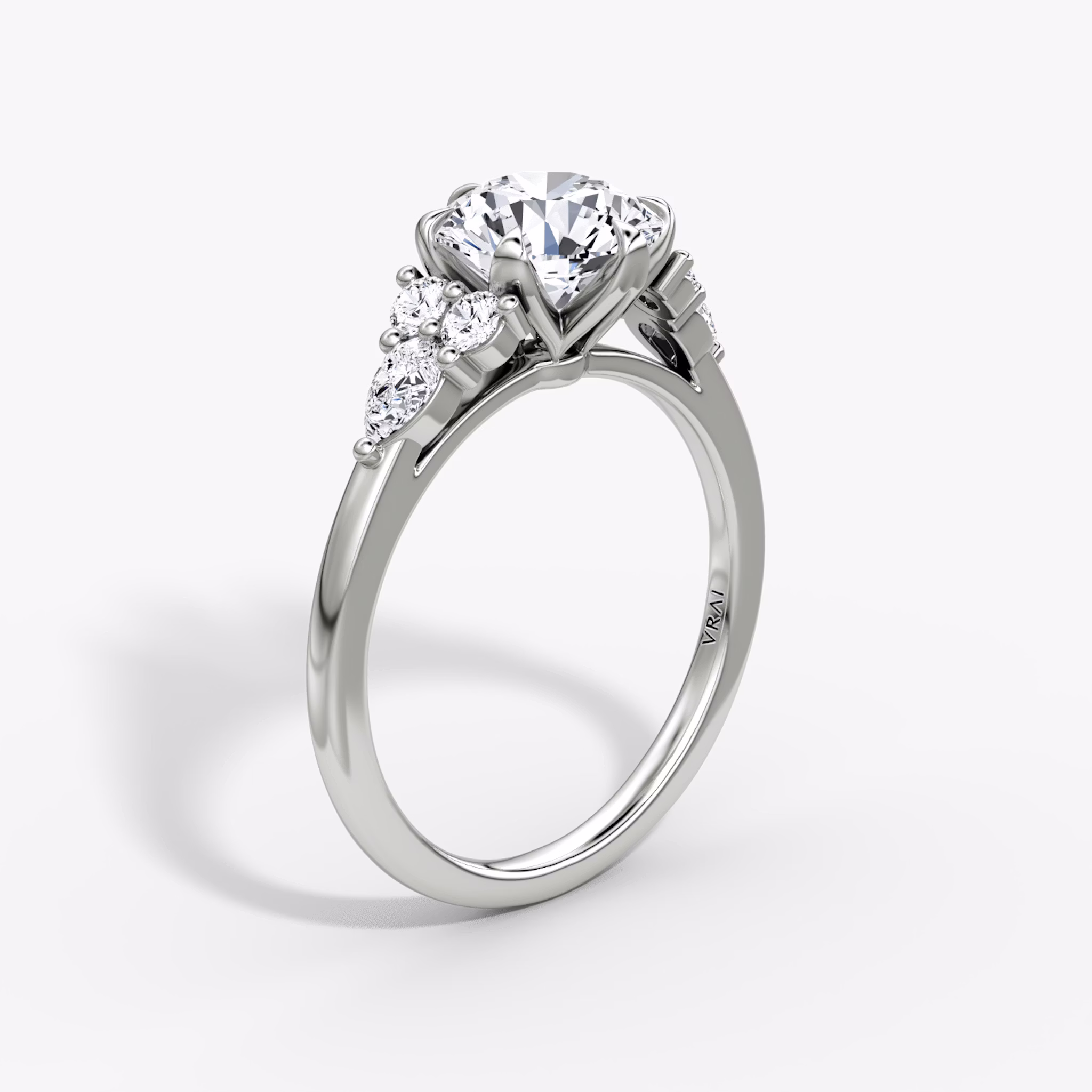 The Pear Cluster Heirloom | Round Brilliant | Platinum | bandAccent: Plain | caratWeight: 1.5ct | diamondOrientation: vertical