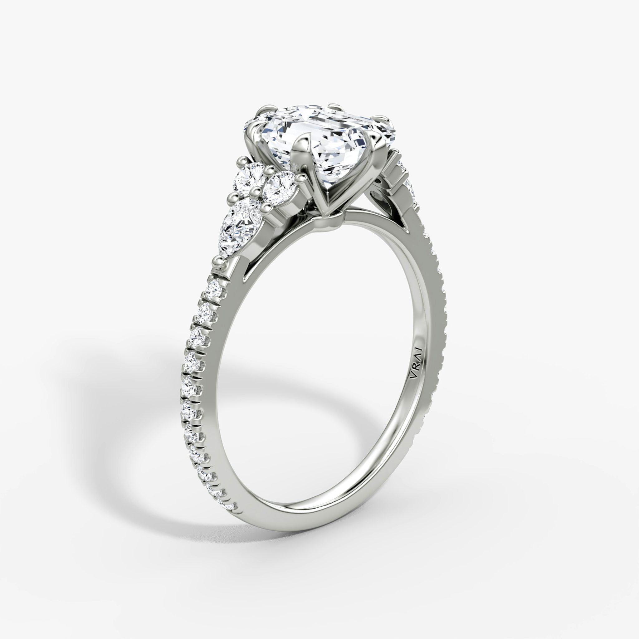 The Pear Cluster Heirloom | Emerald | Platinum | bandAccent: Pavé | diamondOrientation: vertical | caratWeight: other