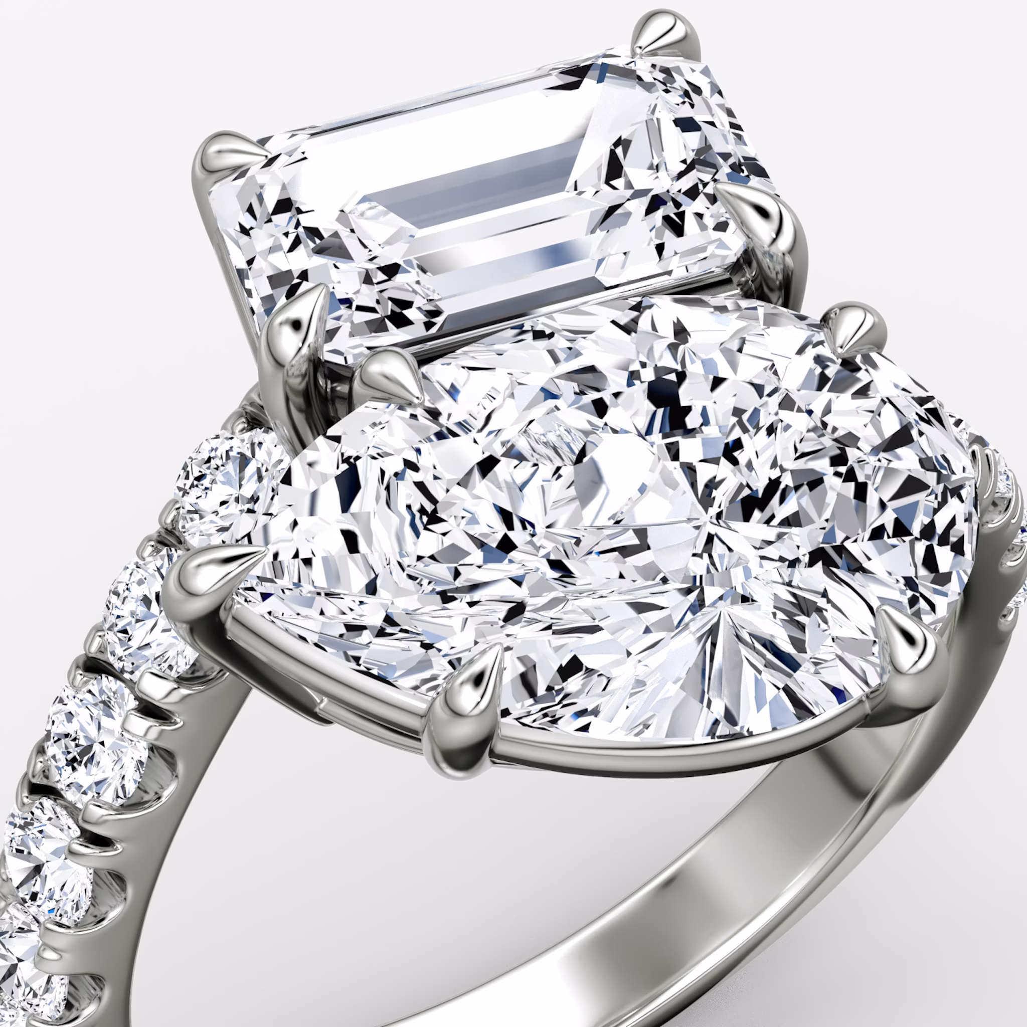 The Toi et Moi Bypass | Emerald and Pear | Platinum | bandAccent: Pavé | diamondOrientation: vertical | caratWeight: other