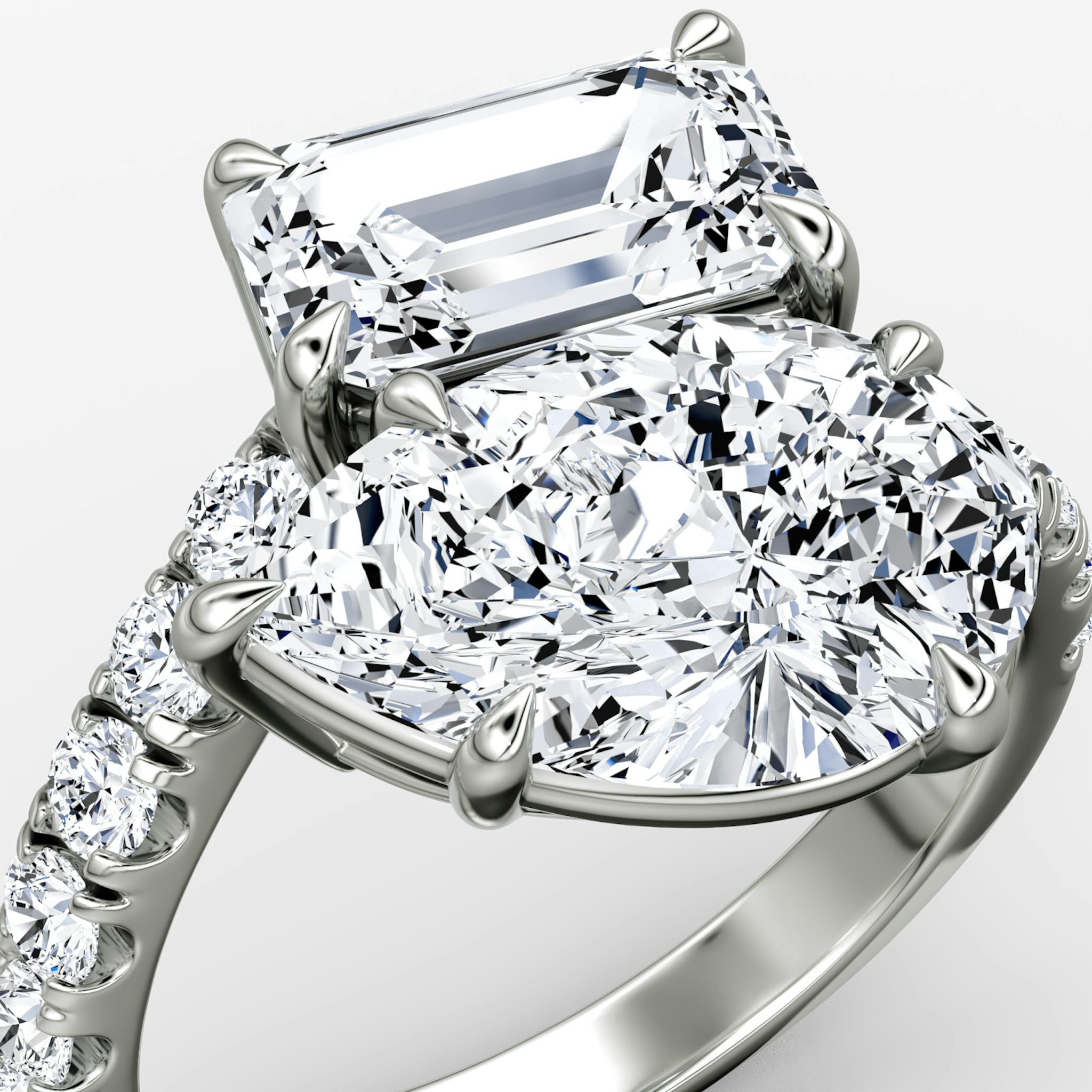 The Toi et Moi Bypass | Emerald and Pear | Platinum | bandAccent: Pavé | diamondOrientation: vertical | caratWeight: other