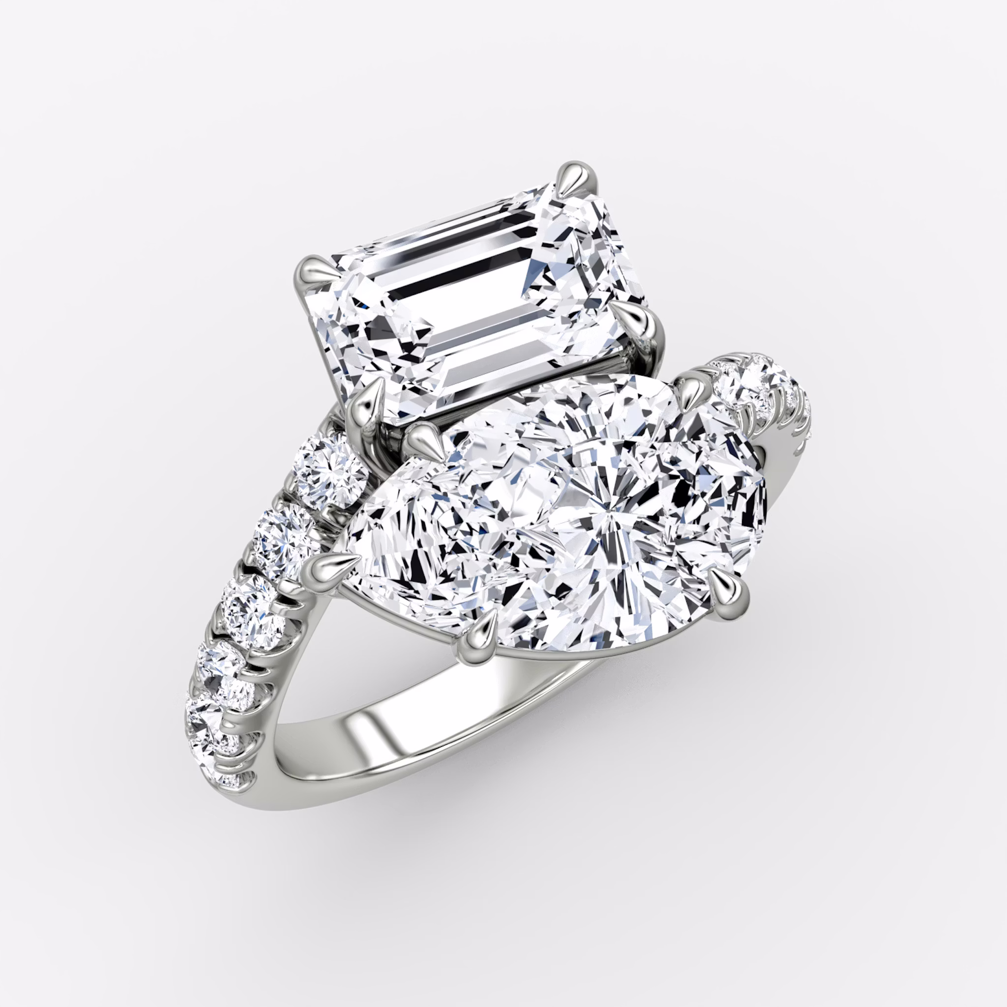 The Toi et Moi Bypass | Emerald and Pear | Platinum | bandAccent: Pavé | diamondOrientation: vertical | caratWeight: other