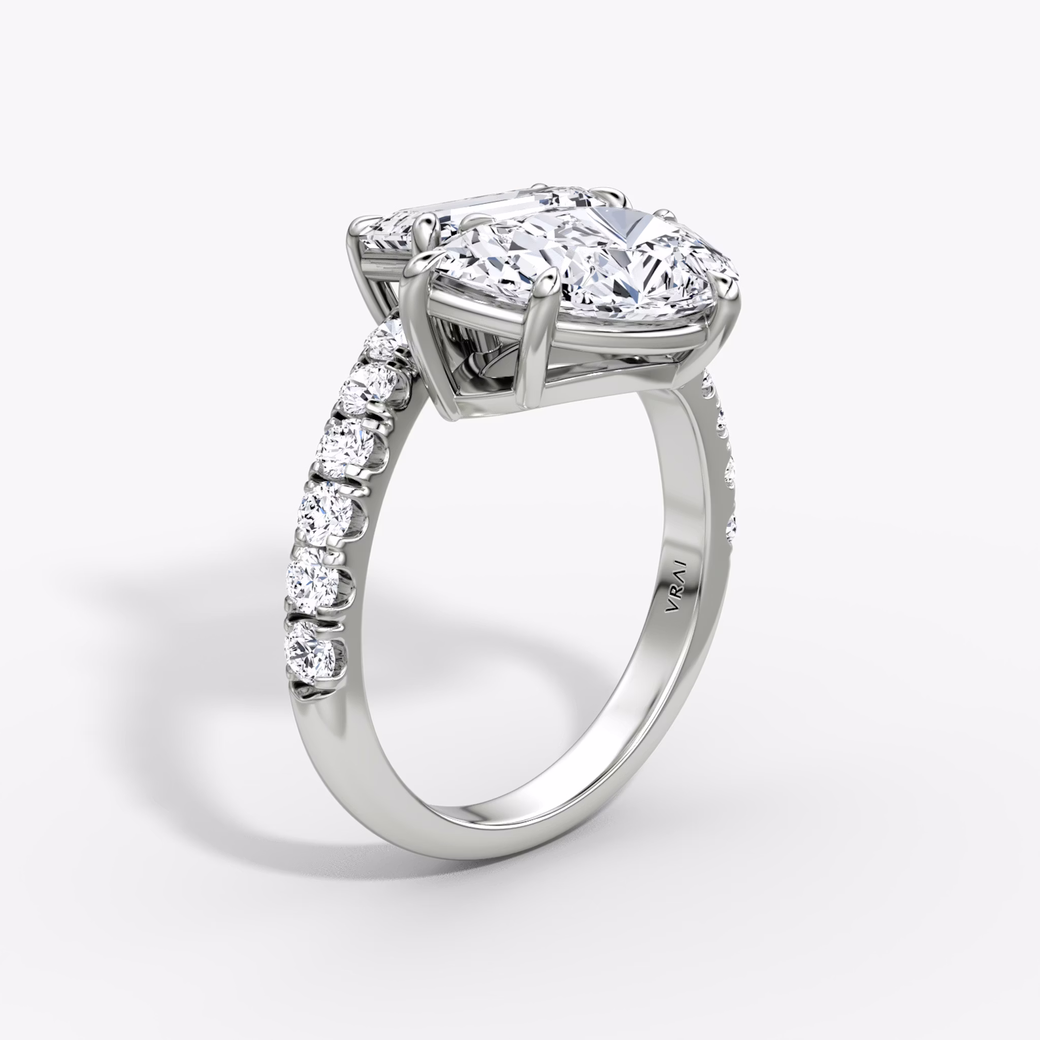 The Toi et Moi Bypass | Emerald and Pear | Platinum | bandAccent: Pavé | diamondOrientation: vertical | caratWeight: other