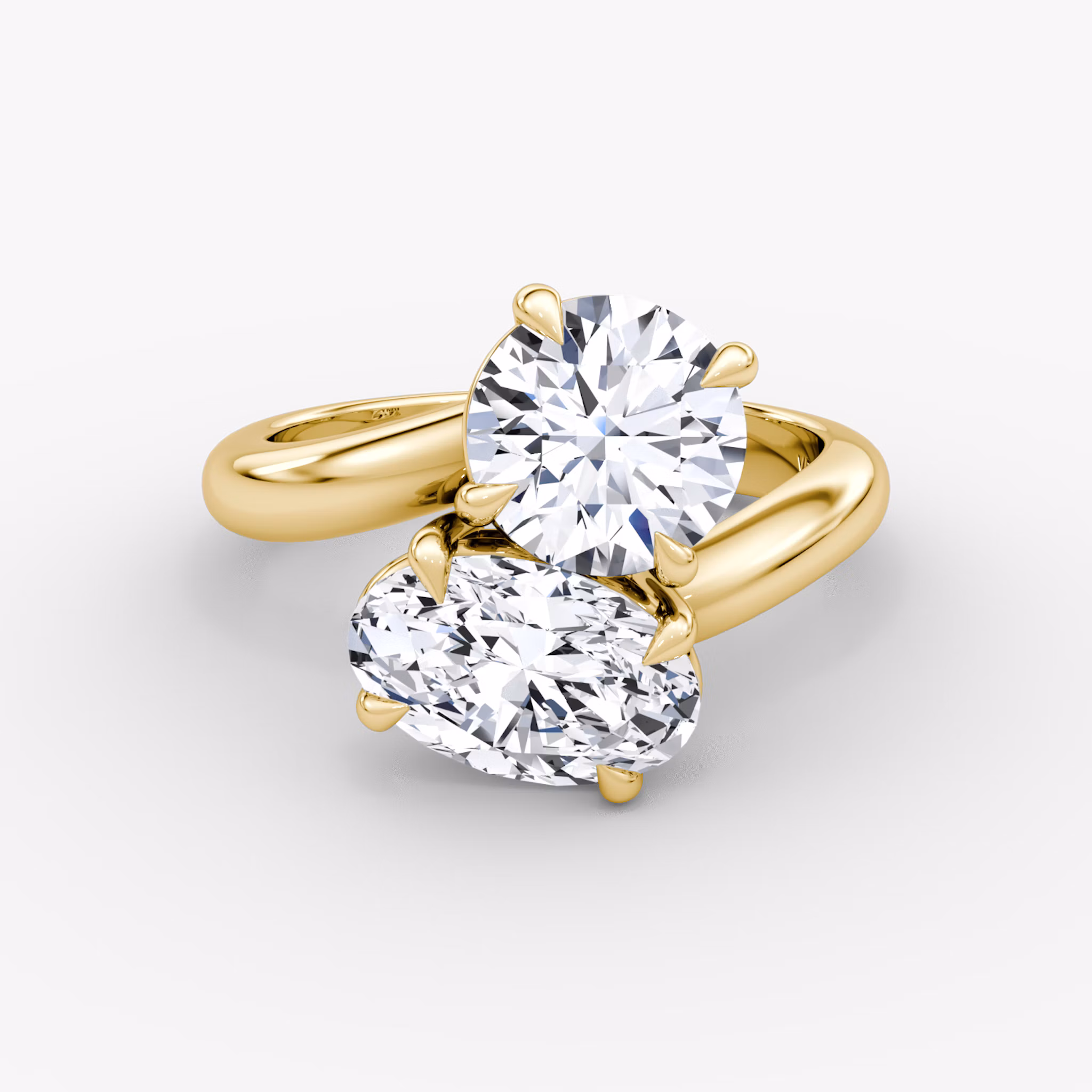 The Toi et Moi Round Brilliant and Oval Yellow Gold Engagement Ring