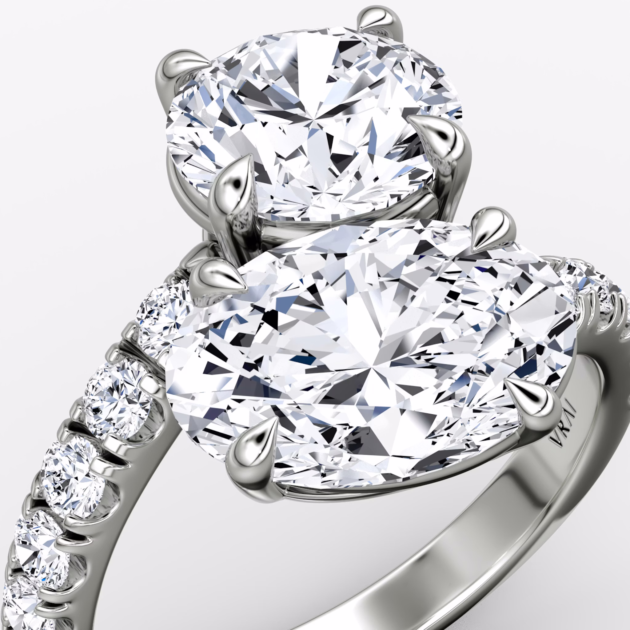 The Toi et Moi Bypass | Round Brilliant and Oval | Platinum | bandAccent: Pavé | diamondOrientation: vertical | caratWeight: other