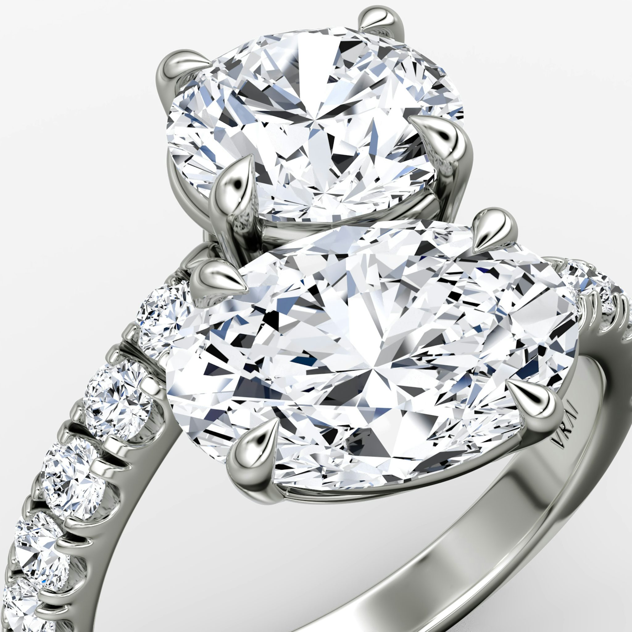 The Toi et Moi Bypass | Round Brilliant and Oval | Platinum | bandAccent: Pavé | diamondOrientation: vertical | caratWeight: other