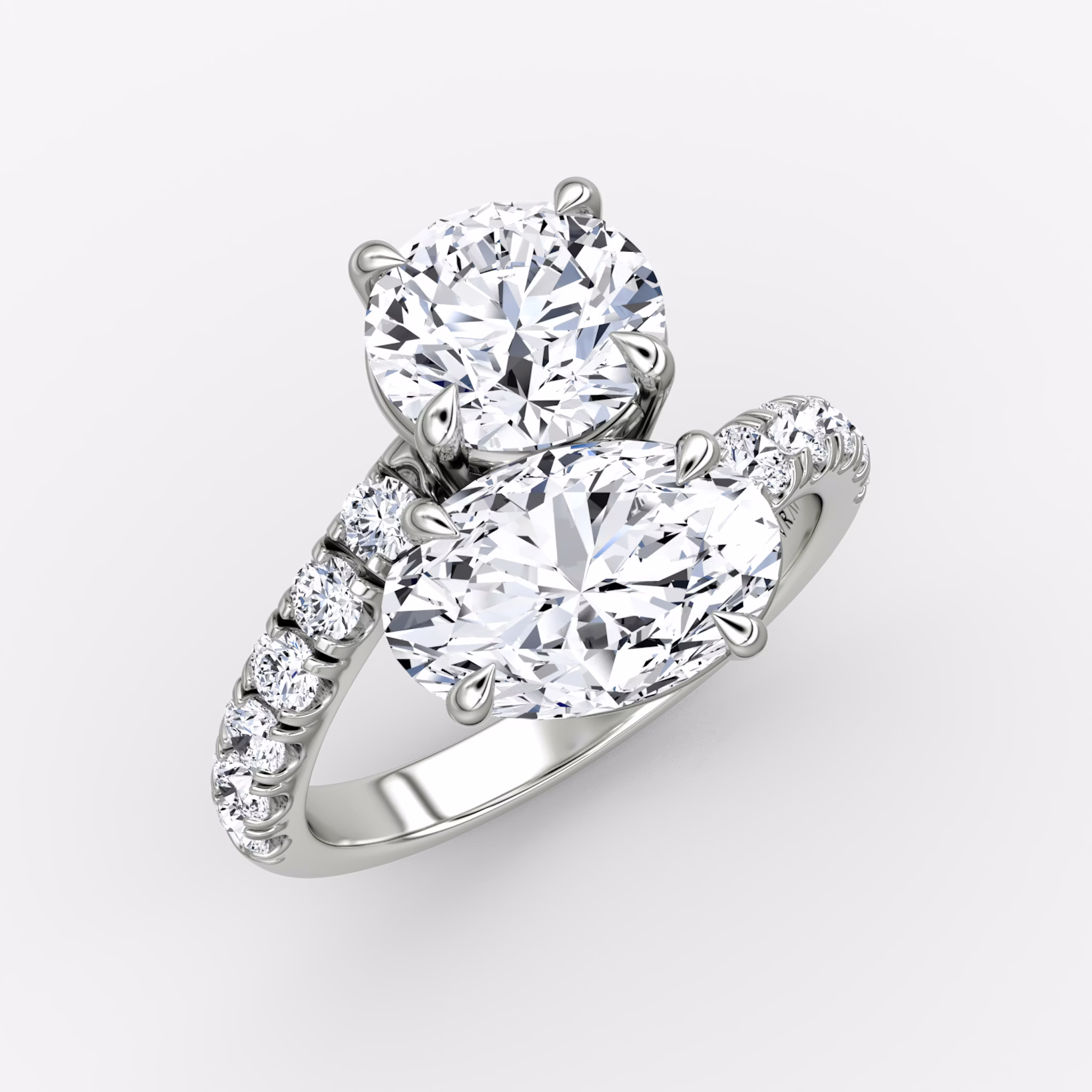 The Toi et Moi Bypass | Round Brilliant and Oval | Platinum | bandAccent: Pavé | diamondOrientation: vertical | caratWeight: other