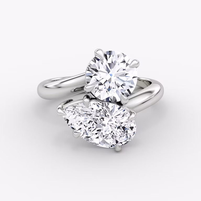 The Toi et Moi Emerald and Pear Platinum Engagement Ring