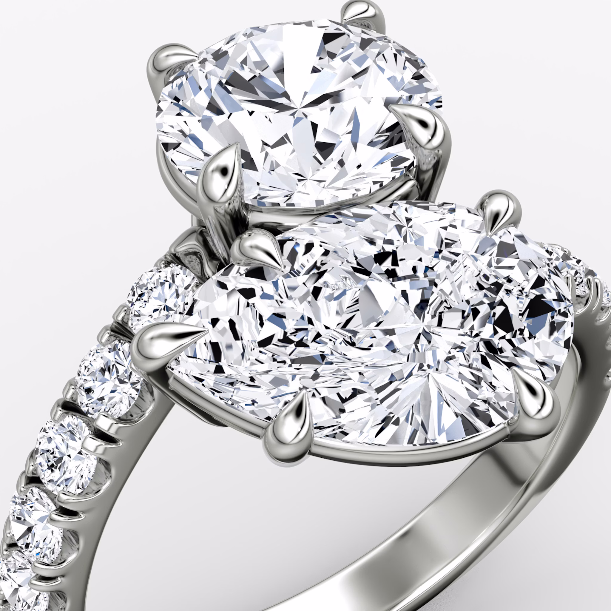 The Toi et Moi Bypass | Round Brilliant and Pear | Platinum | bandAccent: Pavé | diamondOrientation: vertical | caratWeight: other