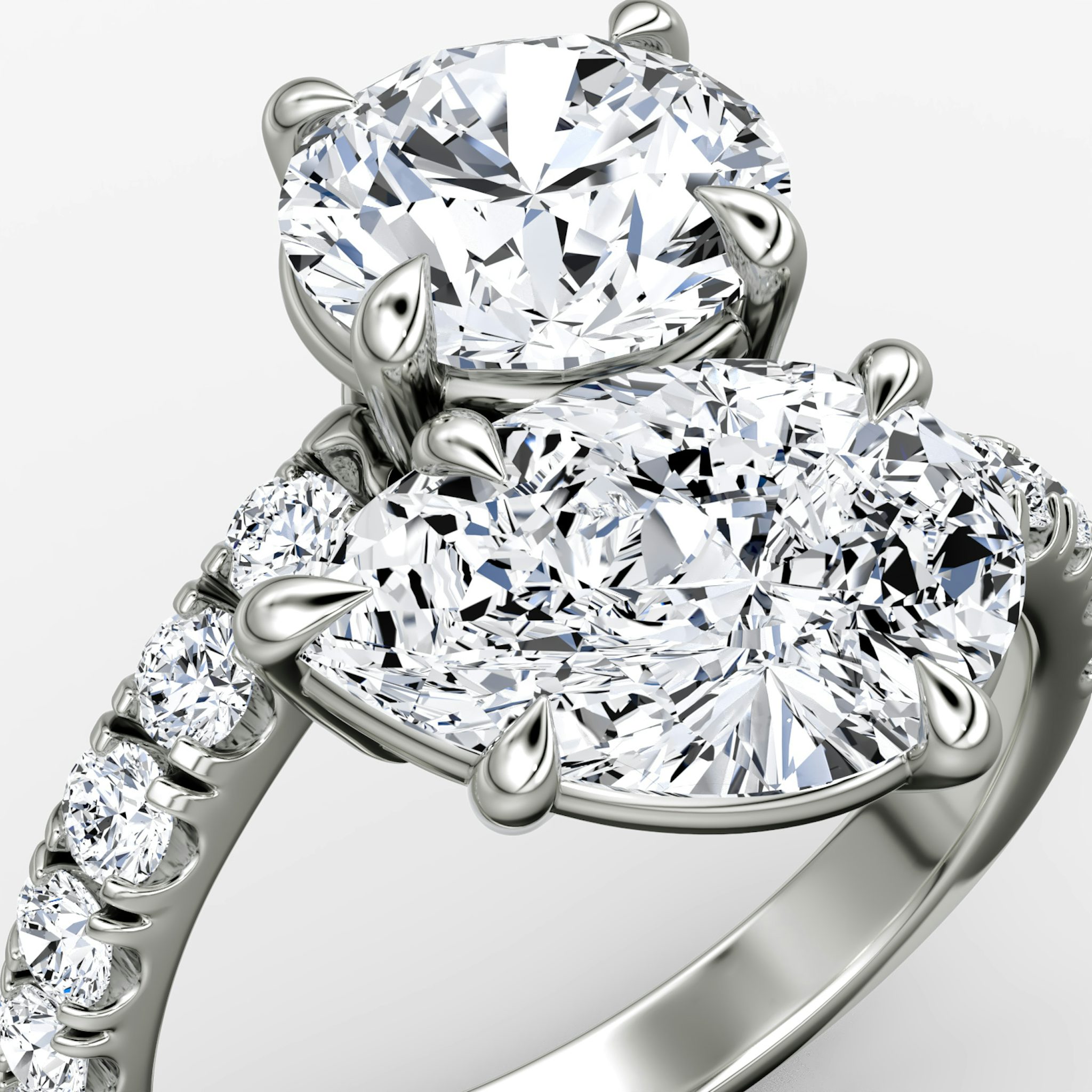 The Toi et Moi Bypass | Round Brilliant and Pear | Platinum | bandAccent: Pavé | diamondOrientation: vertical | caratWeight: other