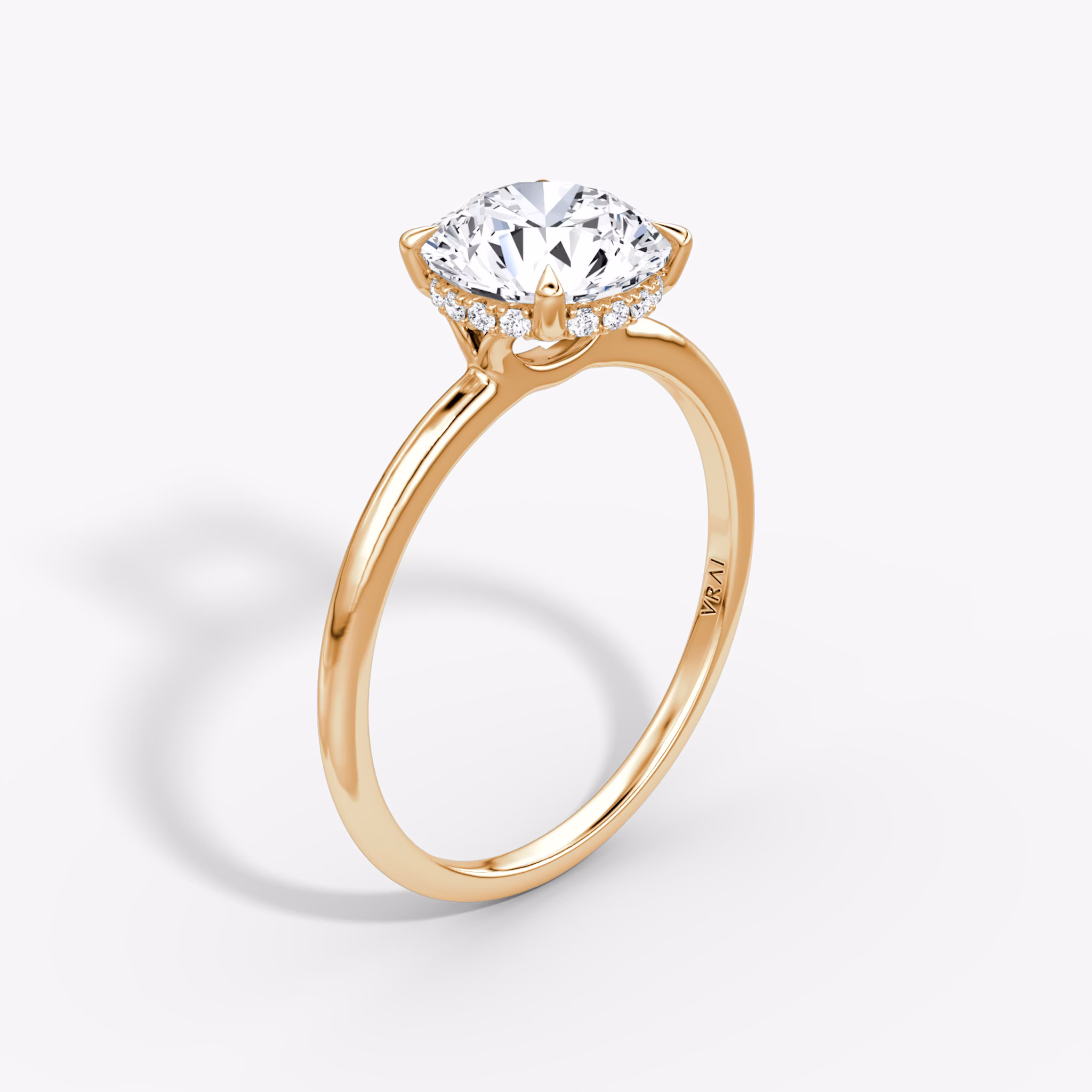The Signature | Round Brilliant | 14k | Rose Gold | bandAccent: Plain | bandWidth: standard | caratWeight: 1.0ct | hiddenHalo: yes | diamondOrientation: vertical