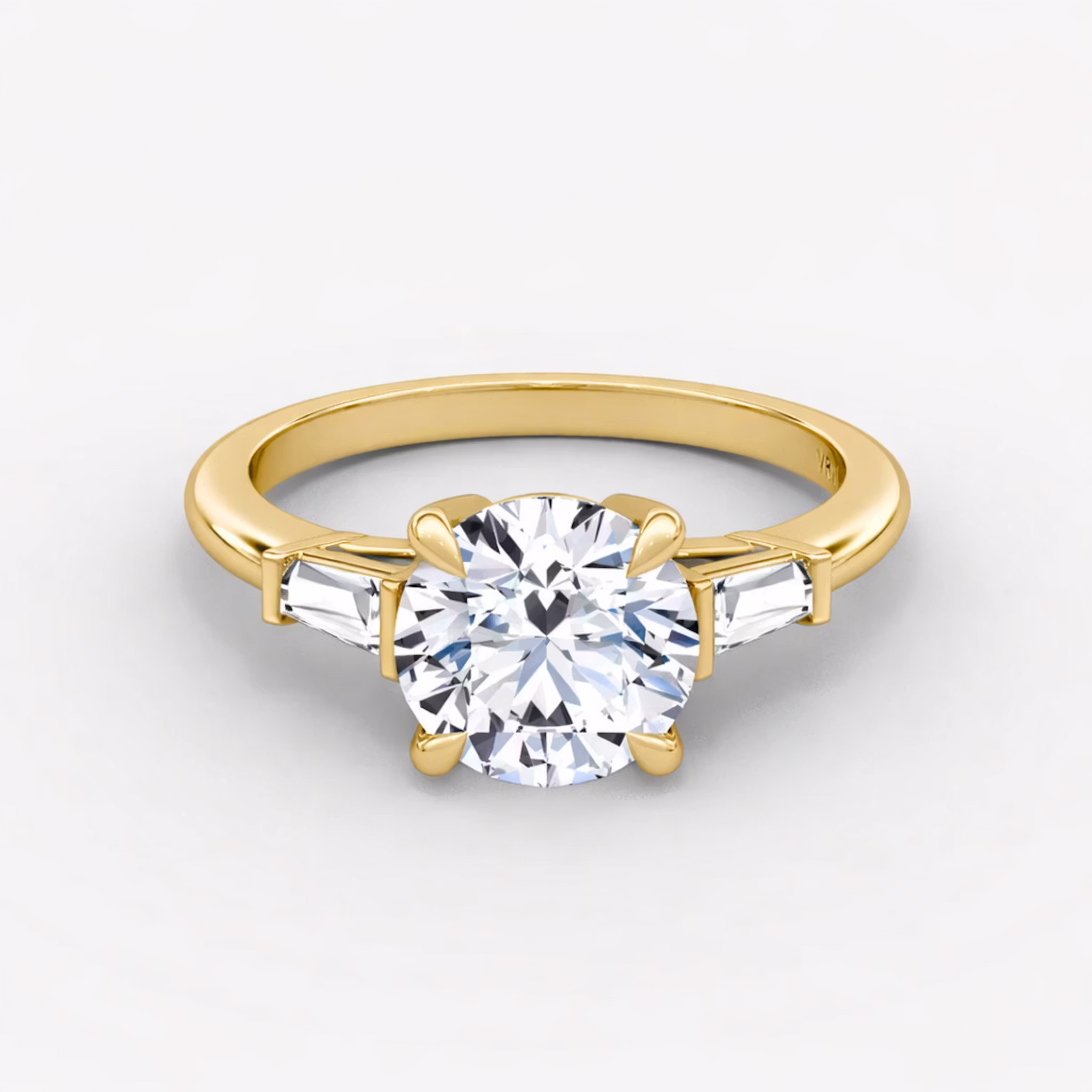 The Tapered Baguette Three Stone Round Brilliant | Yellow Gold