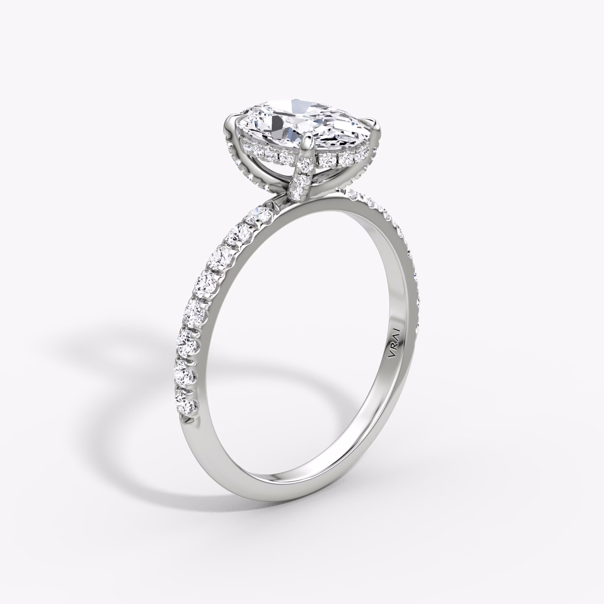 The Classic Hidden Halo | Oval | Platinum | bandAccent: Pavé | bandWidth: large | prongStyle: Pavé | diamondOrientation: vertical | caratWeight: other