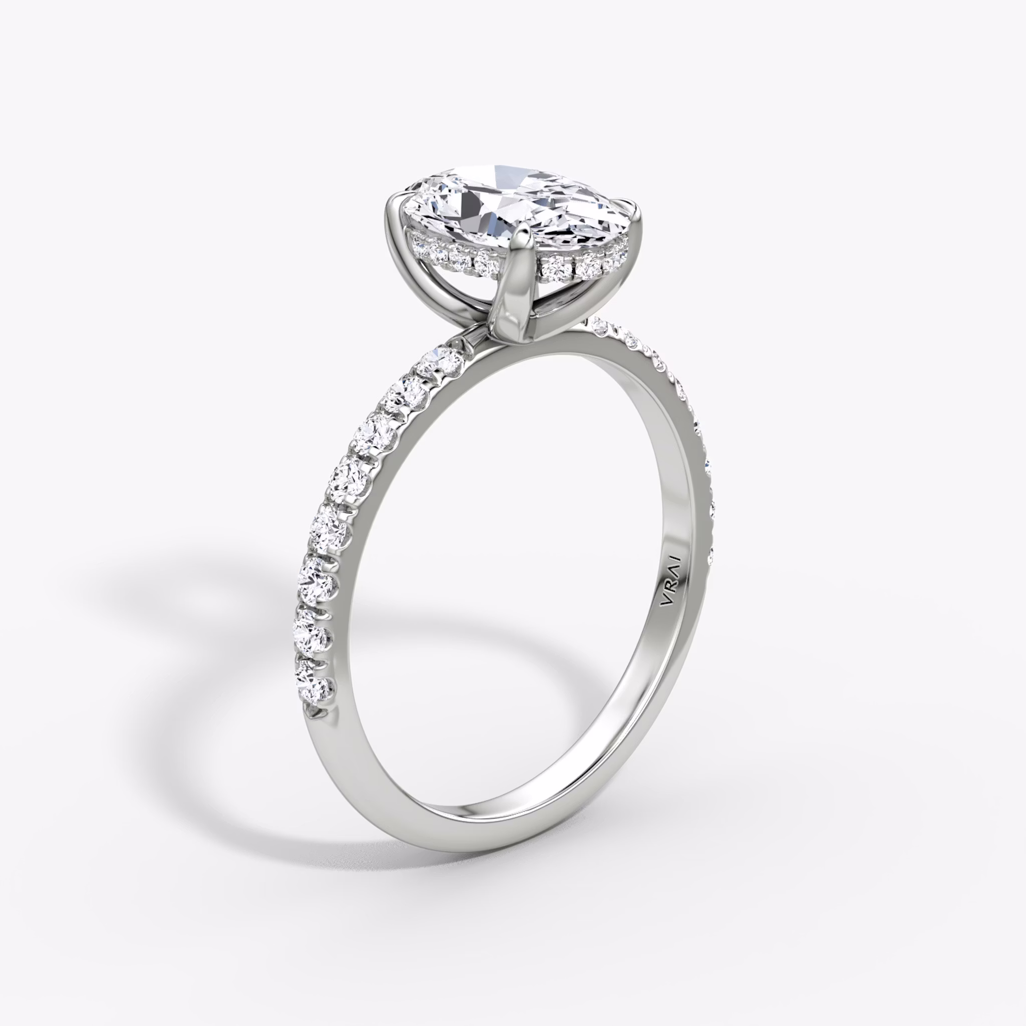 The Classic Hidden Halo | Oval | Platinum | bandAccent: Pavé | bandWidth: large | prongStyle: Plain | diamondOrientation: vertical | caratWeight: other