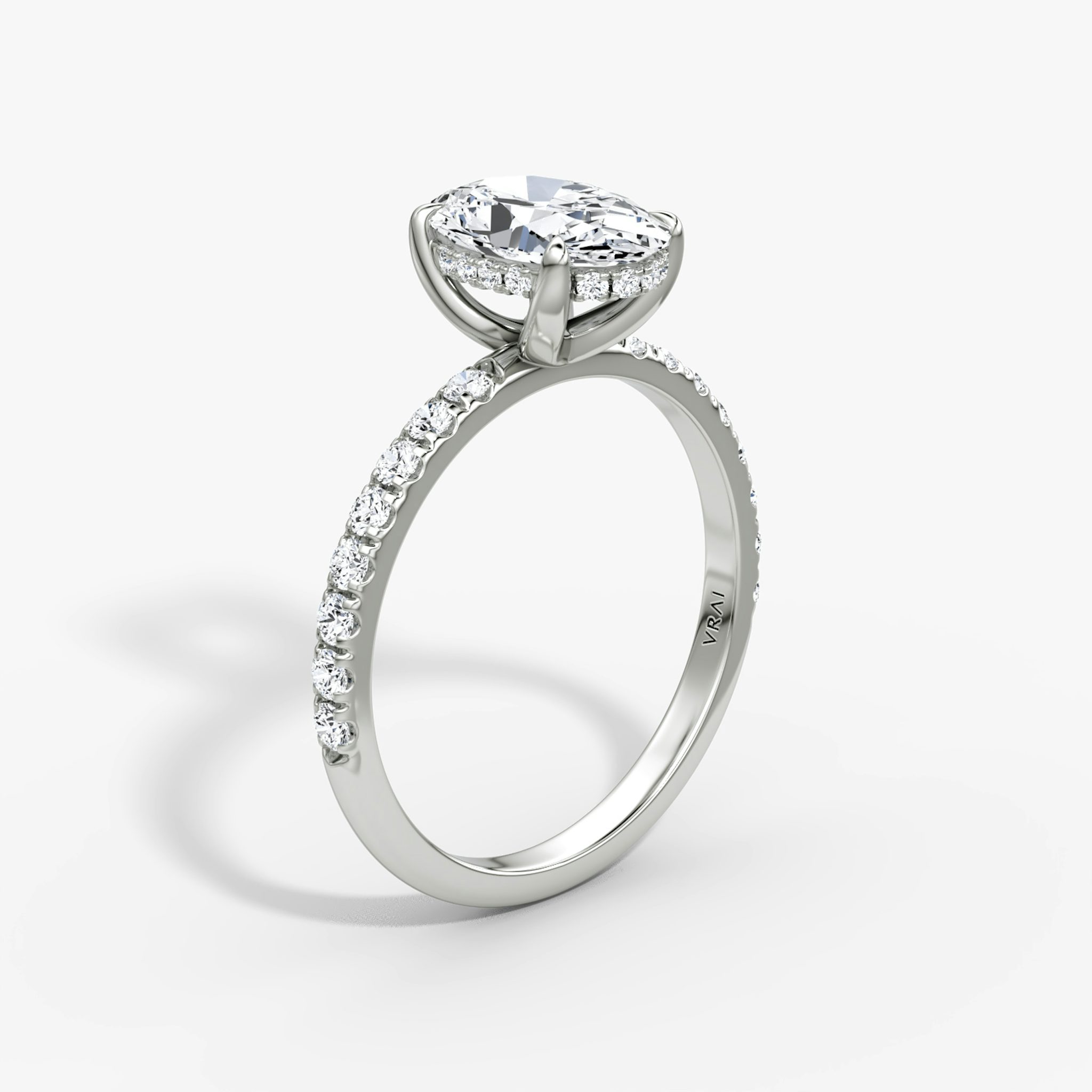 The Classic Hidden Halo | Oval | Platinum | bandAccent: Pavé | bandWidth: large | prongStyle: Plain | diamondOrientation: vertical | caratWeight: other