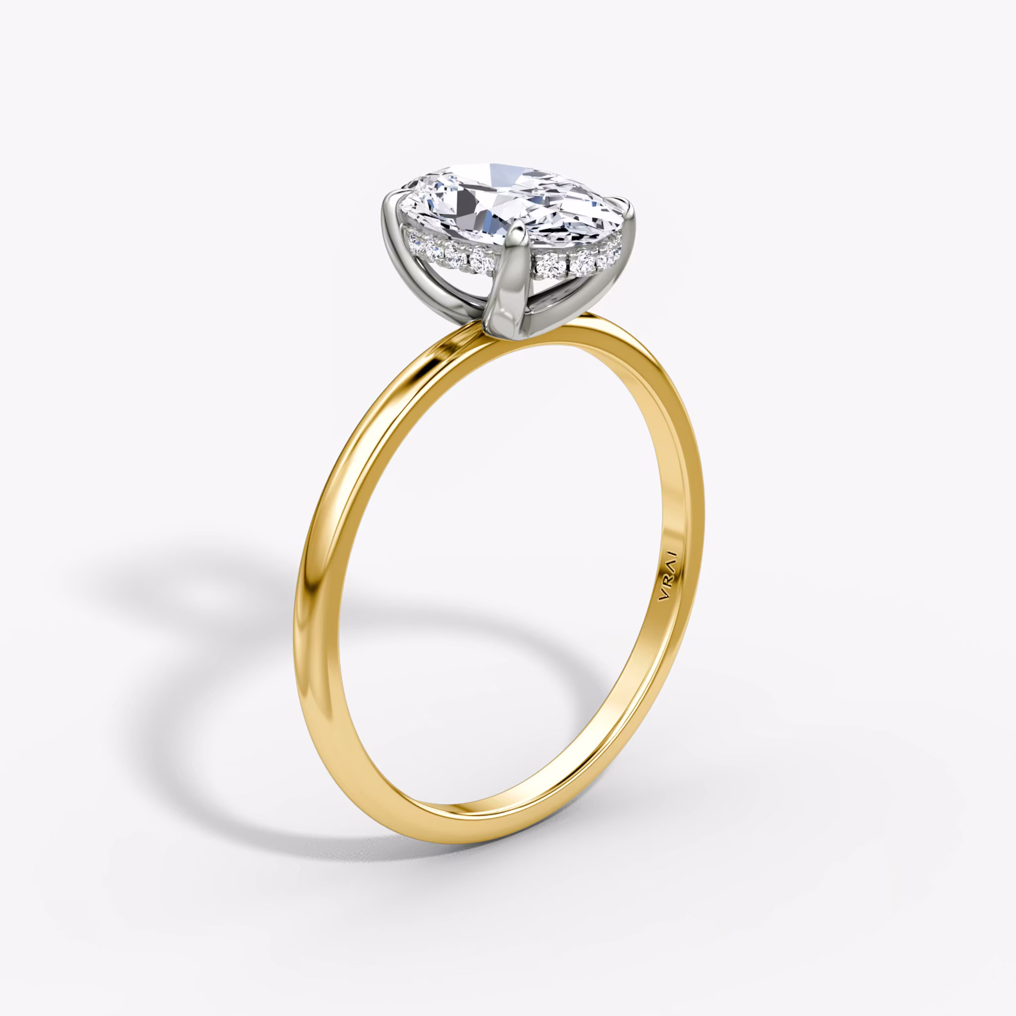 The Classic Hidden Halo Oval | 18K Yellow Gold and Platinum