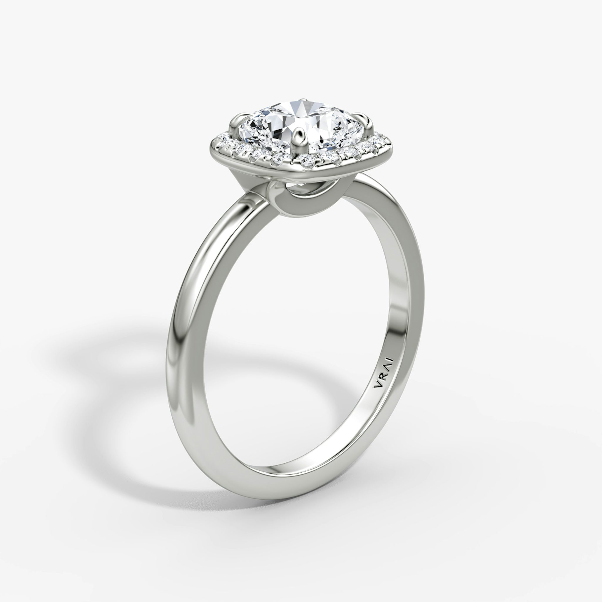 The Halo | Cushion | Platinum | bandAccent: Plain | haloSize: original | diamondOrientation: vertical | caratWeight: other