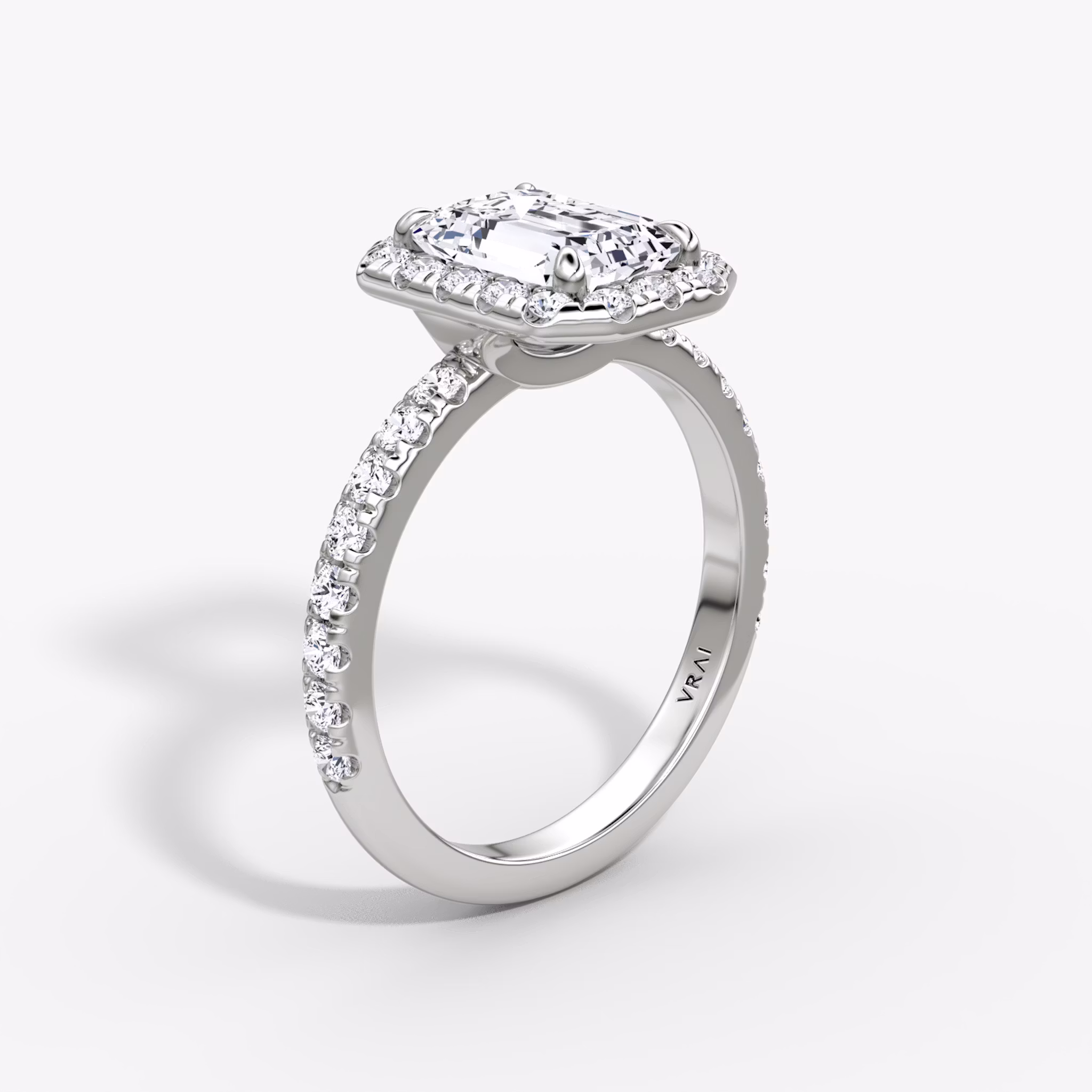 The Halo | Emerald | 18k | White Gold | bandAccent: Pavé | haloSize: large | diamondOrientation: vertical | caratWeight: other