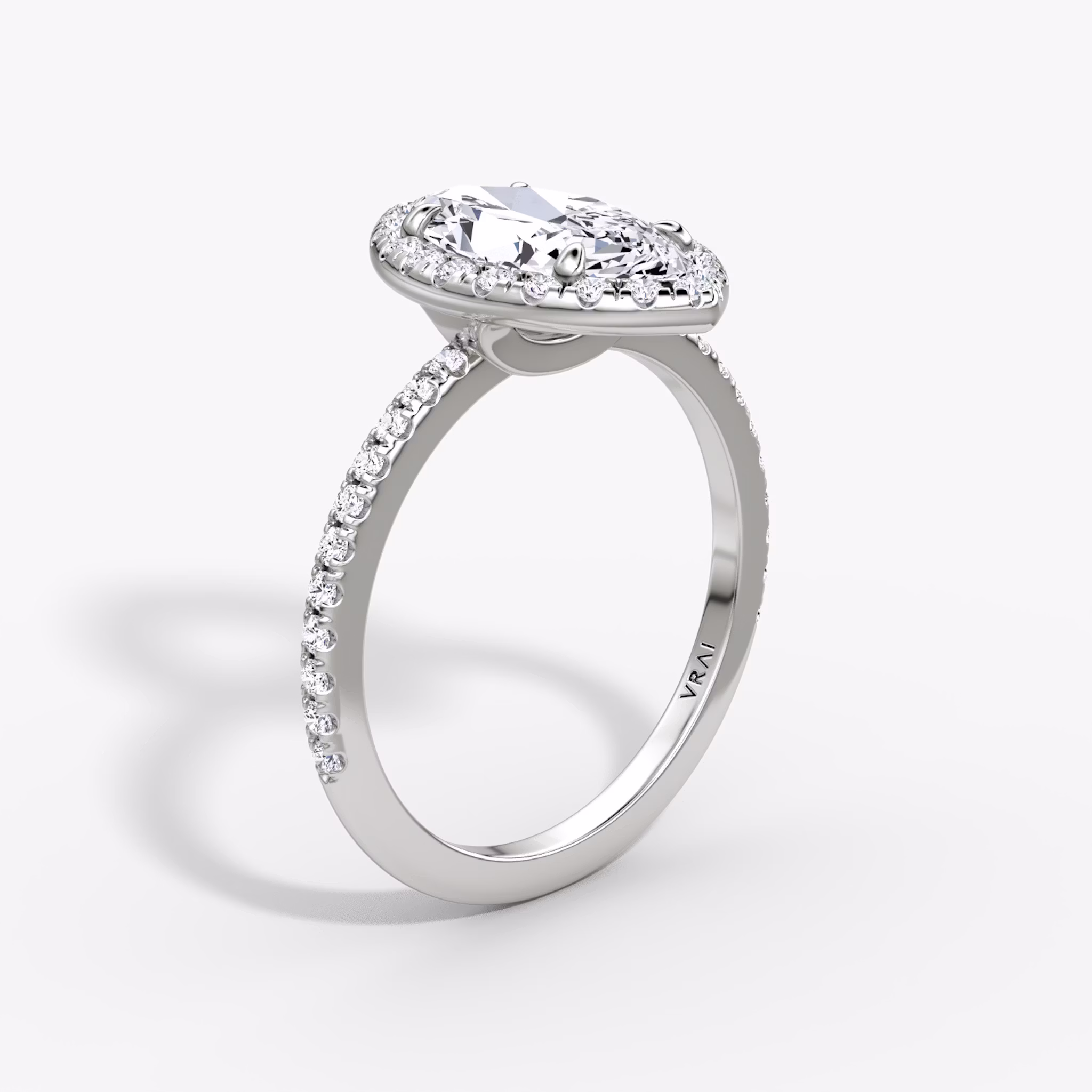 The Halo | Marquise | Platinum | bandAccent: Pavé | haloSize: original | diamondOrientation: vertical | caratWeight: other
