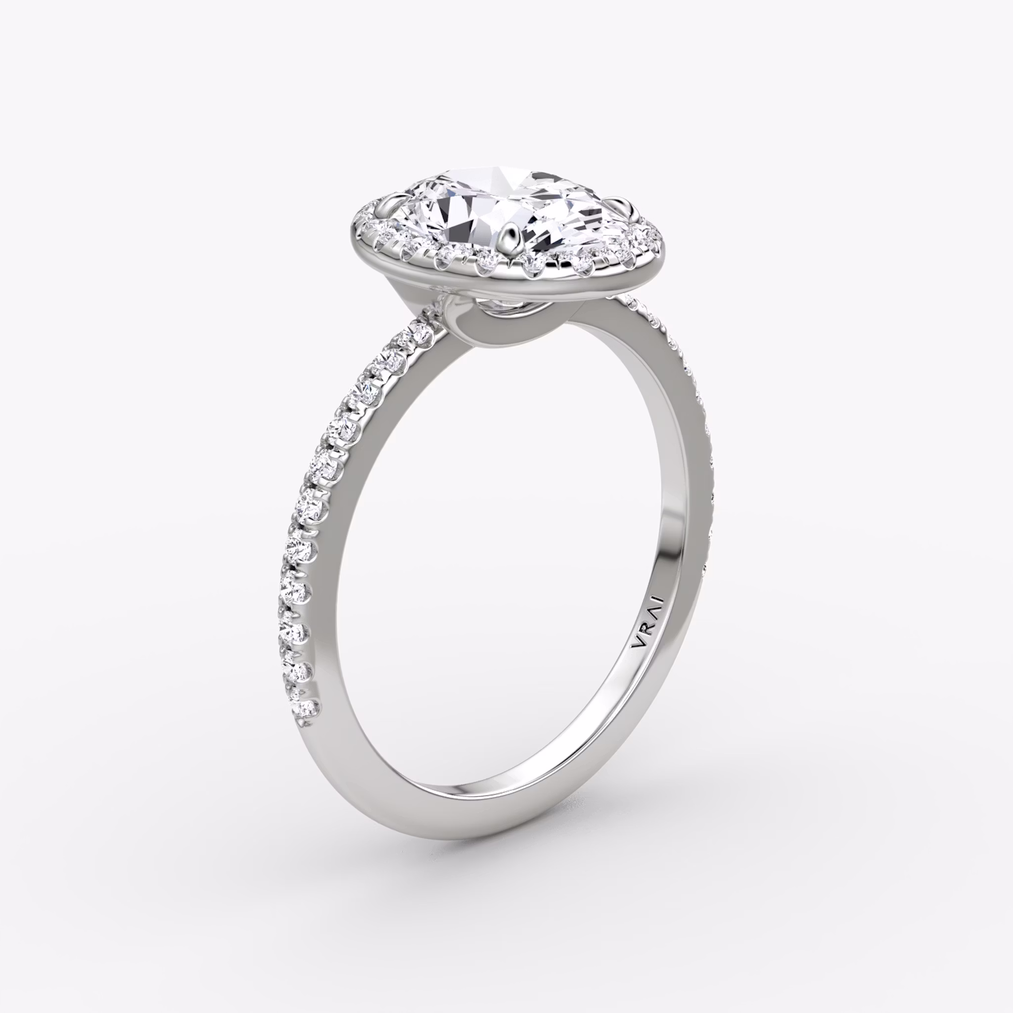 The Halo | Oval | 18k | White Gold | bandAccent: Pavé | haloSize: original | diamondOrientation: vertical | caratWeight: other
