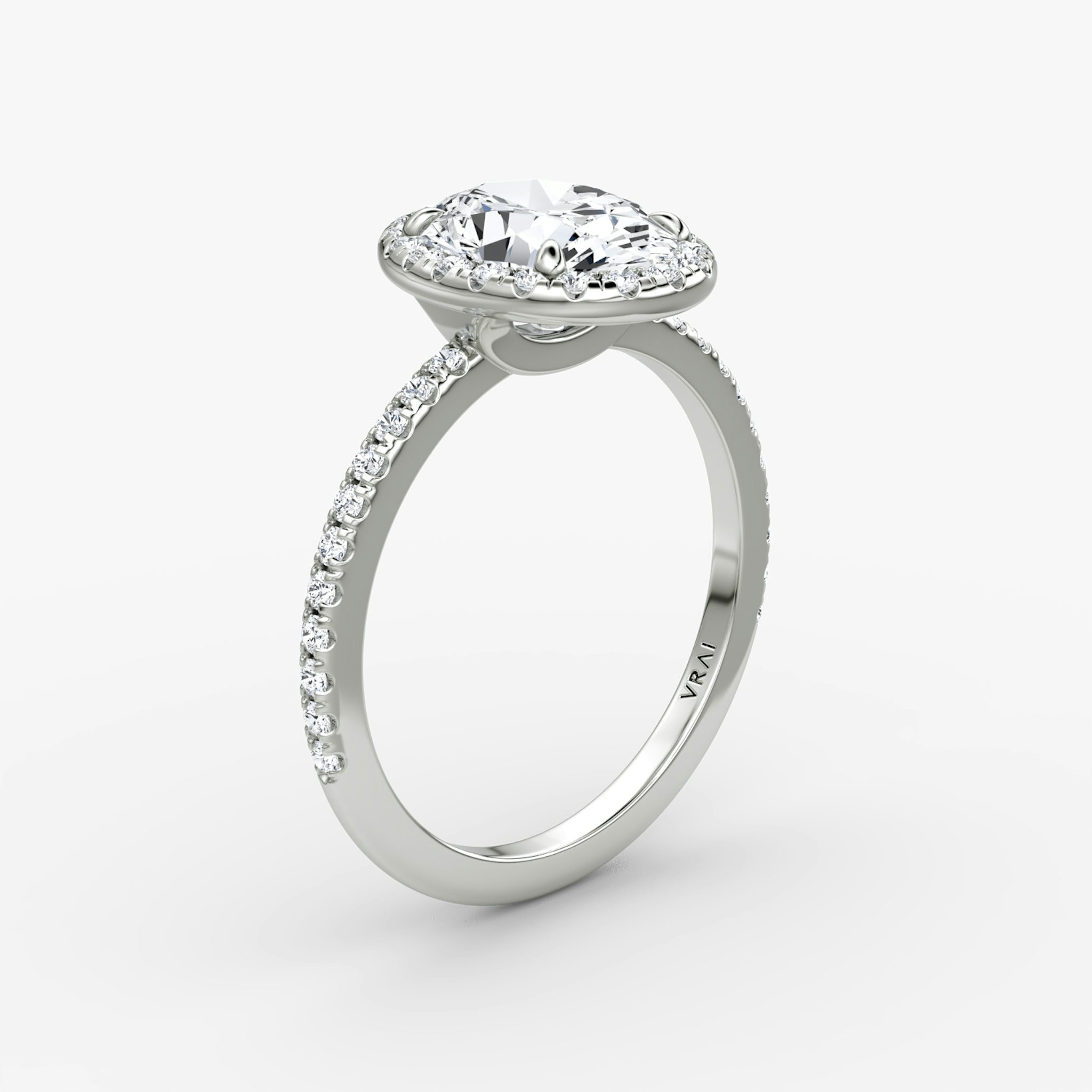 The Halo | Oval | 18k | White Gold | bandAccent: Pavé | haloSize: original | diamondOrientation: vertical | caratWeight: other