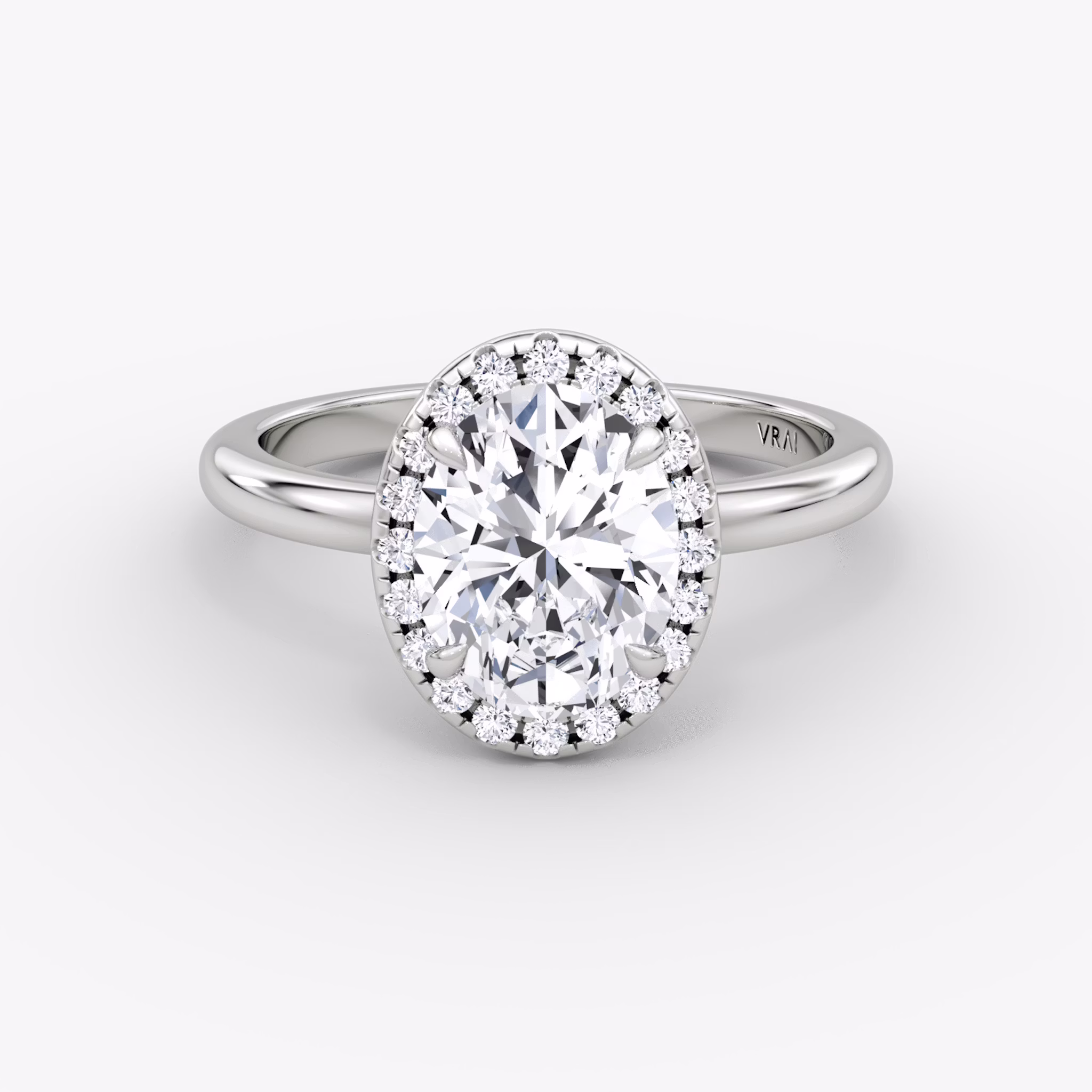 The Halo | Oval | Platinum | bandAccent: Plain | haloSize: original | diamondOrientation: vertical | caratWeight: other