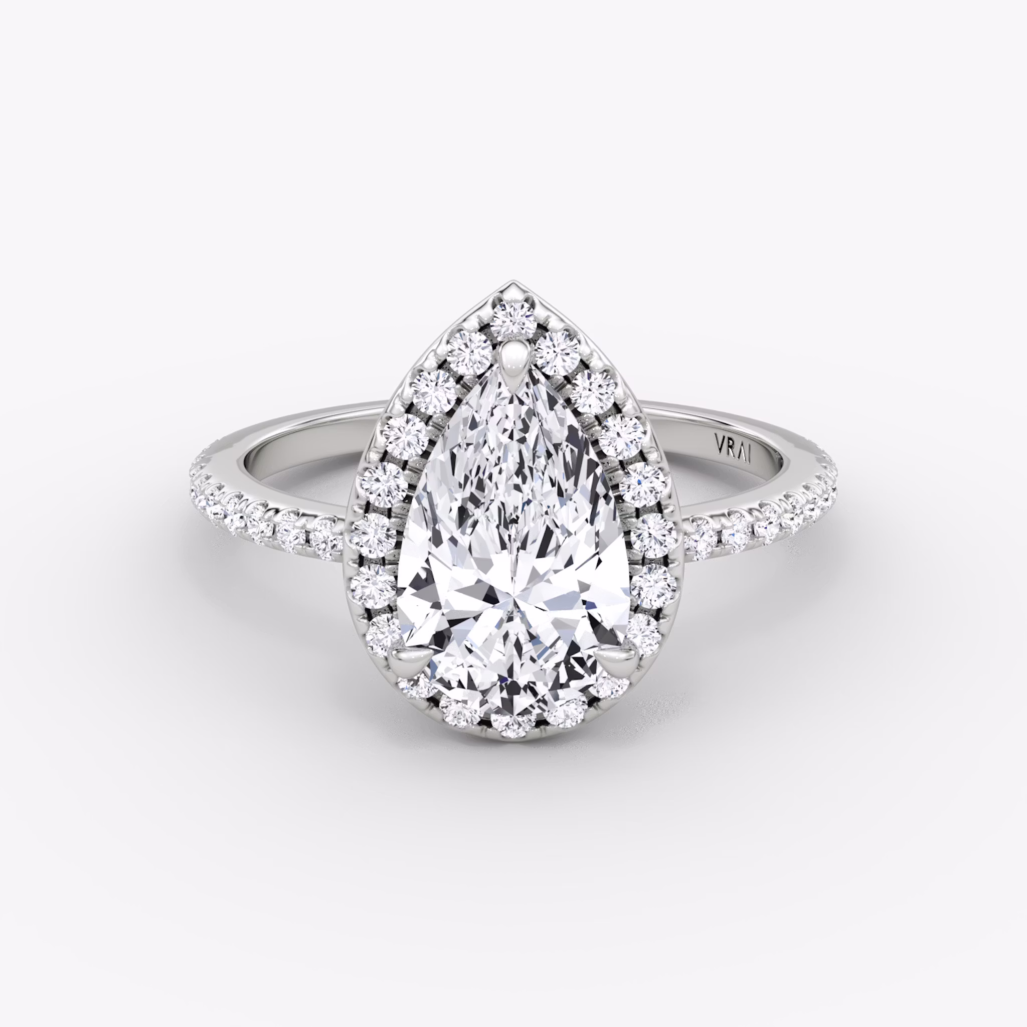 The Halo | Pear | Platinum | bandAccent: Pavé | haloSize: original | diamondOrientation: vertical | caratWeight: other