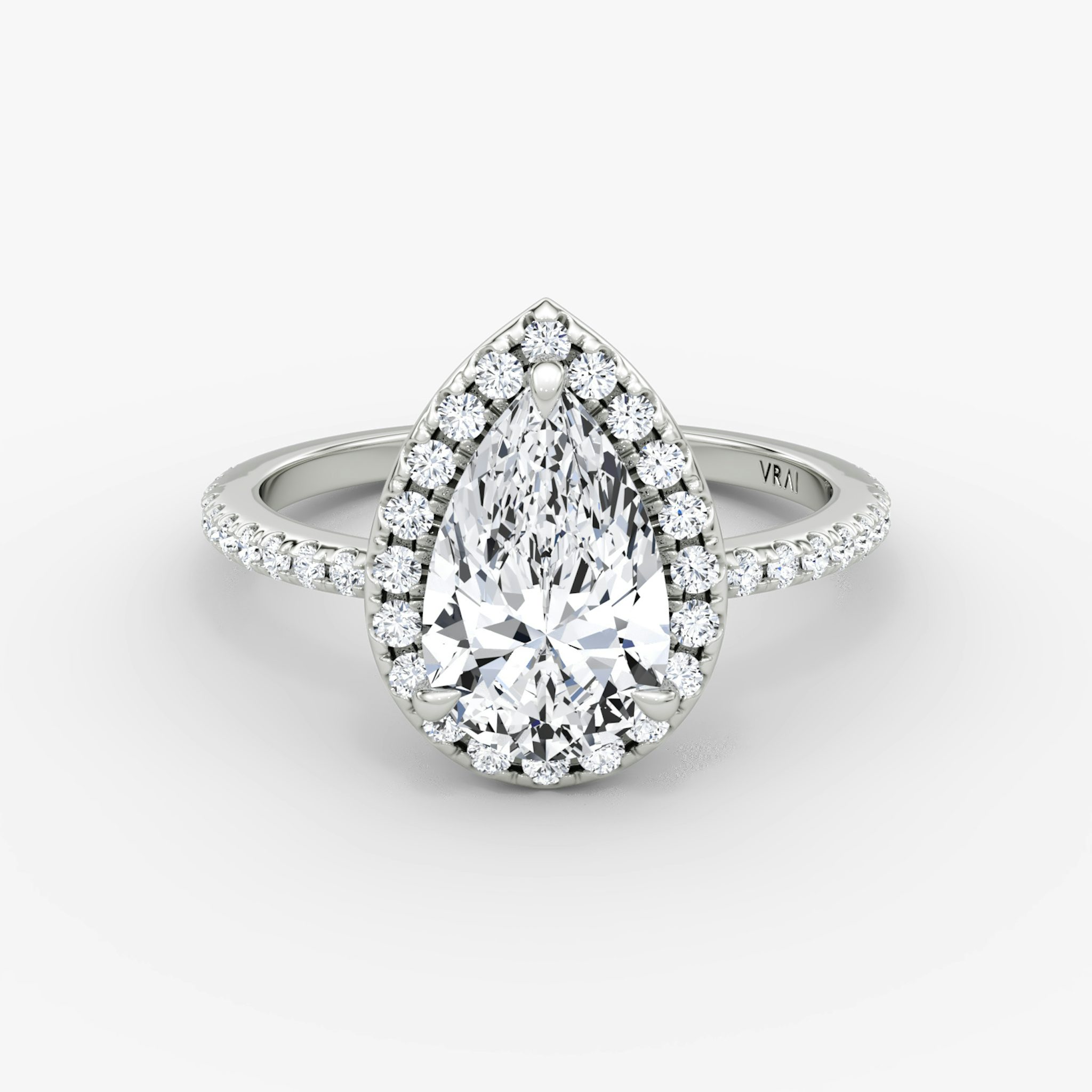 The Halo | Pear | Platinum | bandAccent: Pavé | haloSize: original | diamondOrientation: vertical | caratWeight: other