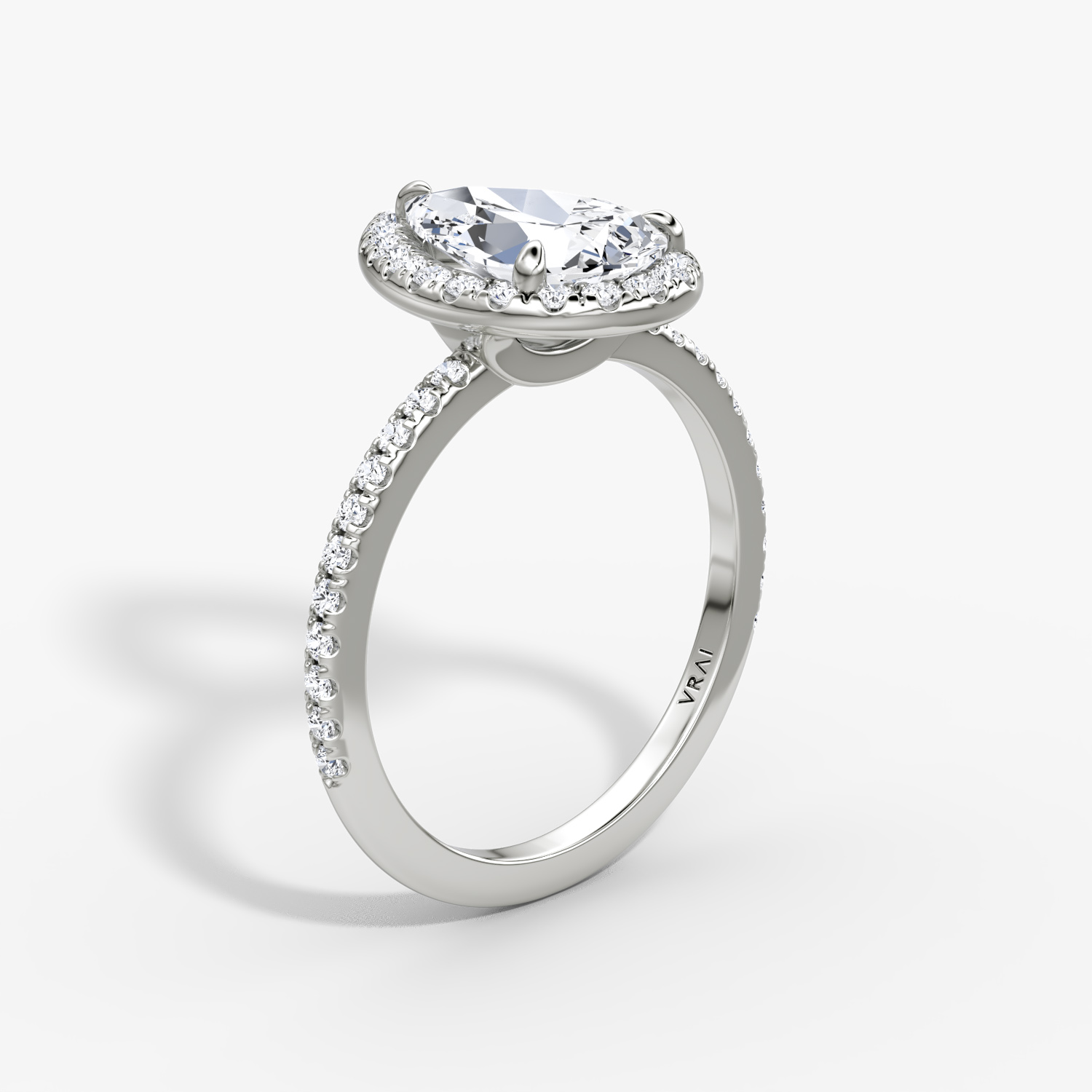 The Halo | Pear | Platinum | bandAccent: Pavé | haloSize: original | diamondOrientation: vertical | caratWeight: other