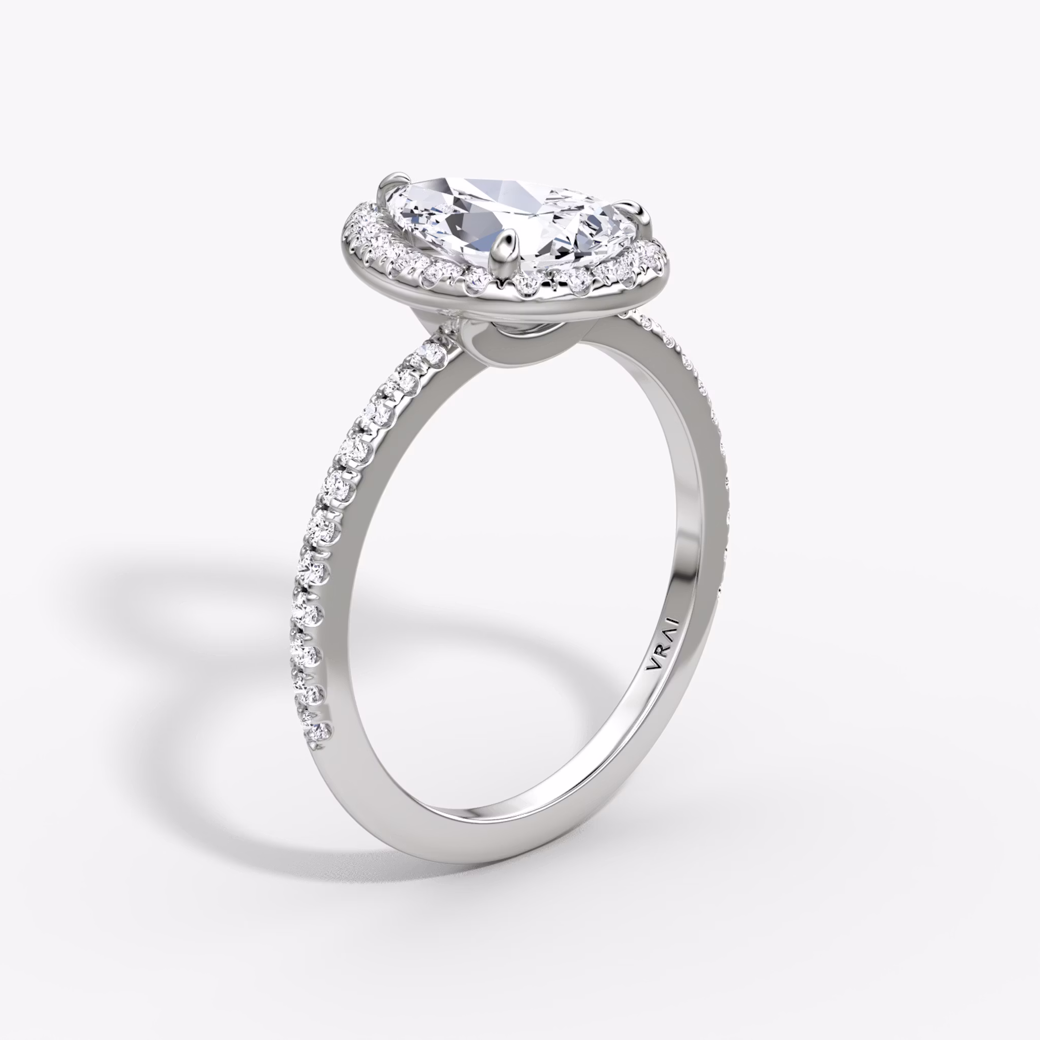The Halo | Pear | Platinum | bandAccent: Pavé | haloSize: original | diamondOrientation: vertical | caratWeight: other