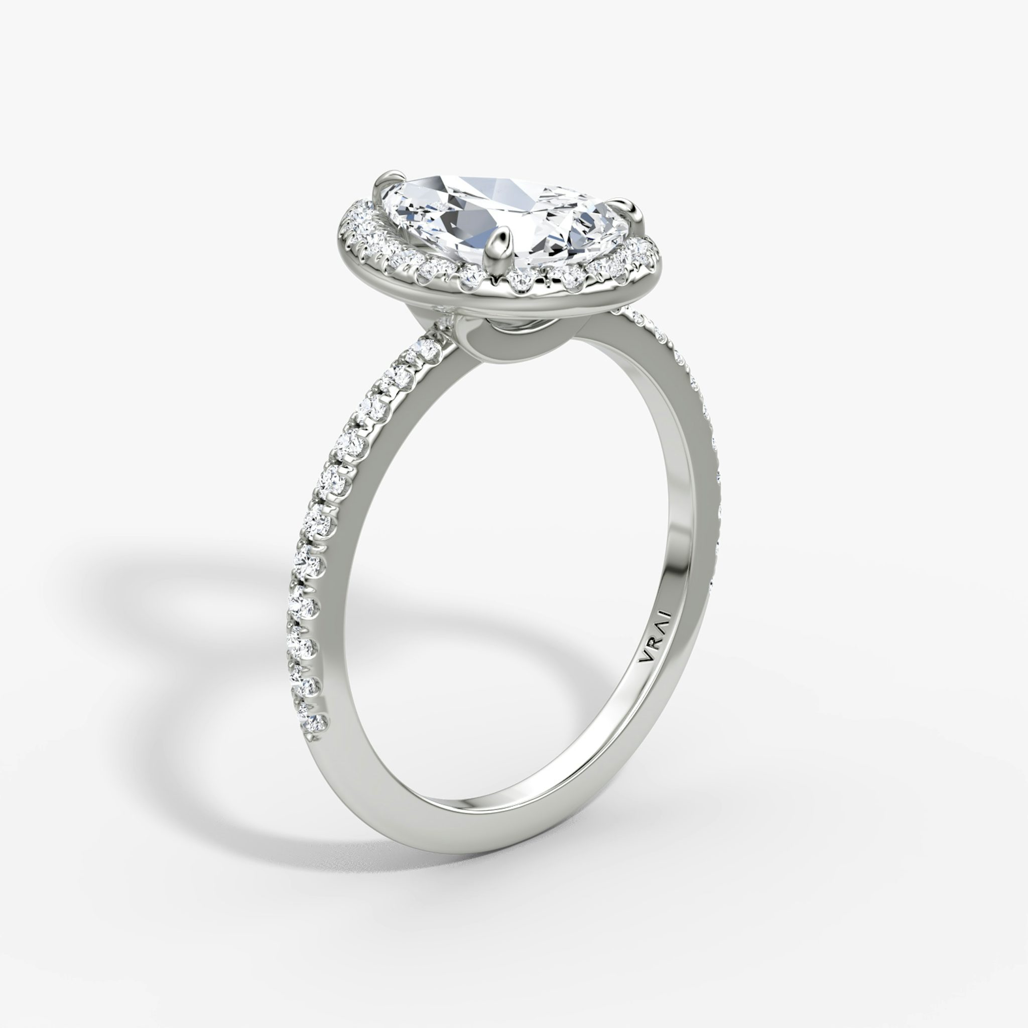 The Halo | Pear | Platinum | bandAccent: Pavé | haloSize: original | diamondOrientation: vertical | caratWeight: other