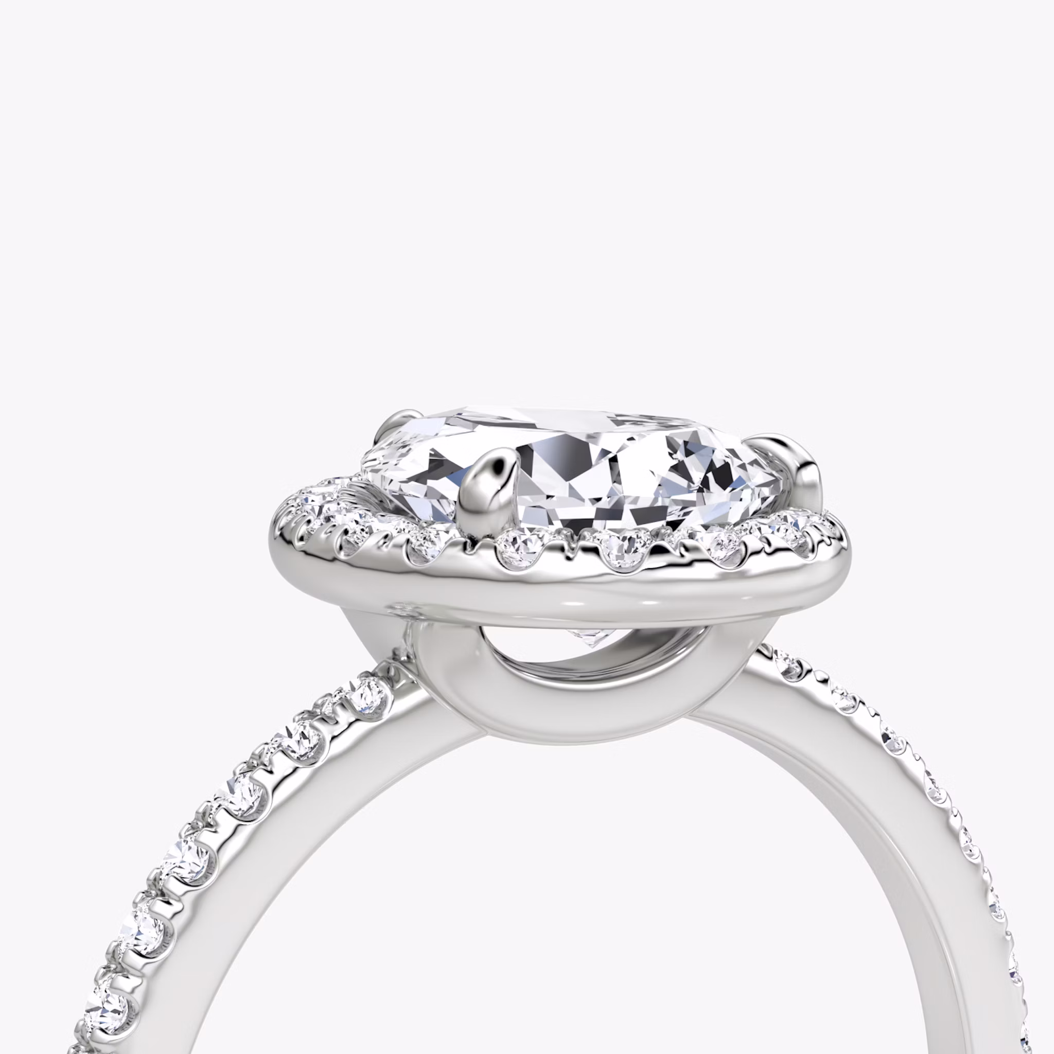 The Halo | Pear | Platinum | bandAccent: Pavé | haloSize: original | diamondOrientation: vertical | caratWeight: other