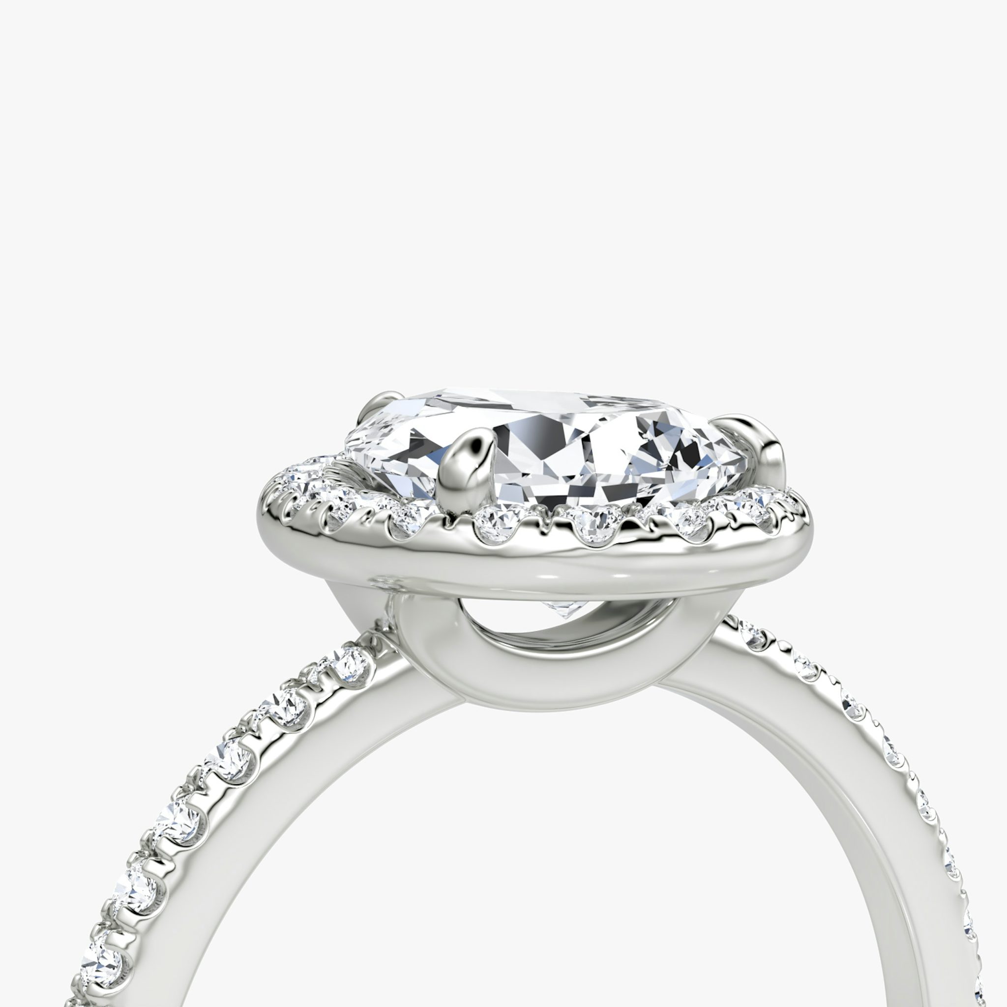 The Halo | Pear | Platinum | bandAccent: Pavé | haloSize: original | diamondOrientation: vertical | caratWeight: other