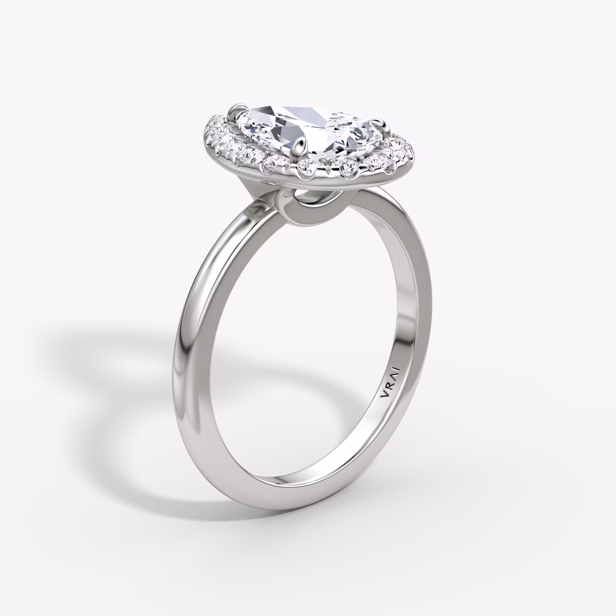 The Halo | Pear | Platinum | bandAccent: Plain | haloSize: large | diamondOrientation: vertical | caratWeight: other