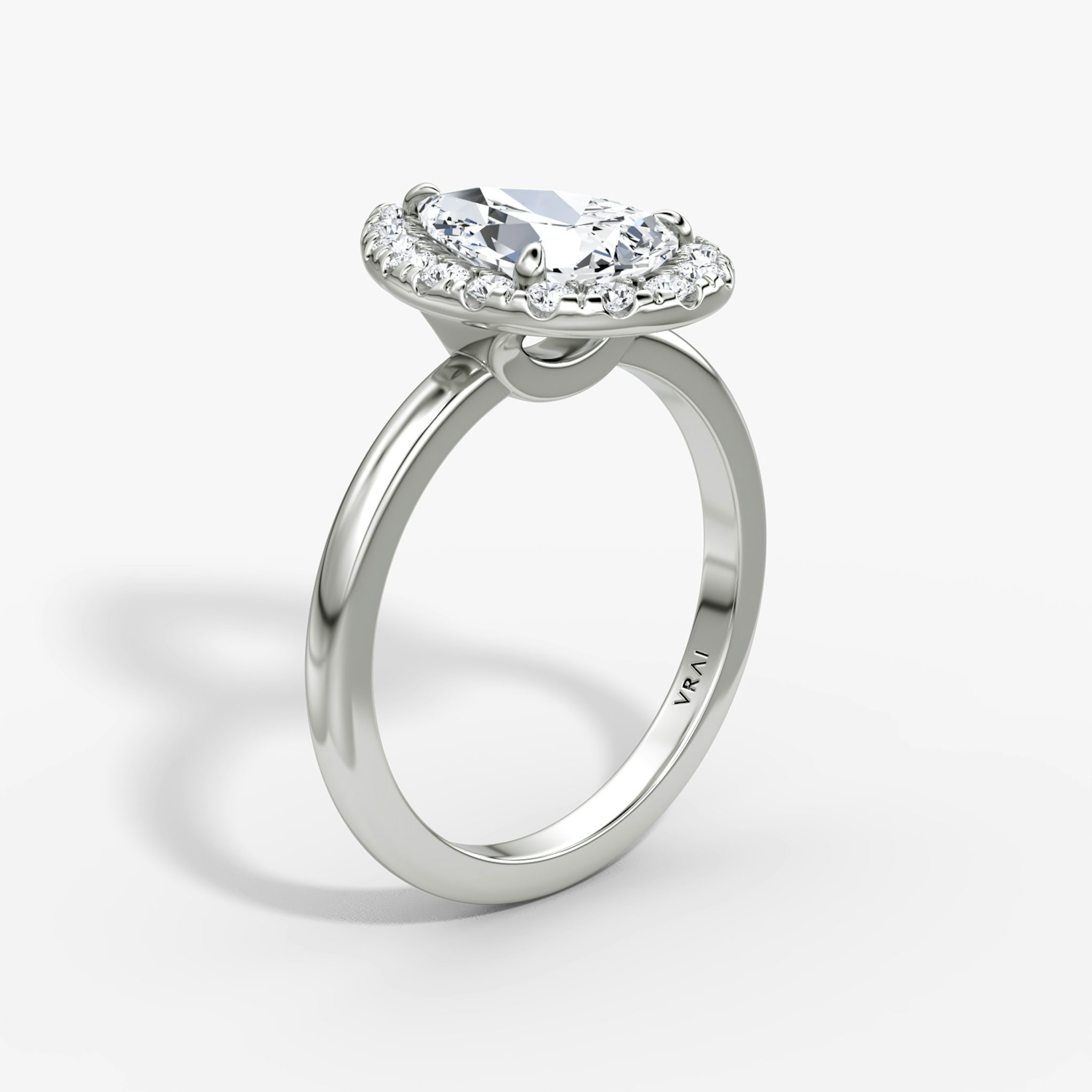 The Halo | Pear | Platinum | bandAccent: Plain | haloSize: large | diamondOrientation: vertical | caratWeight: other