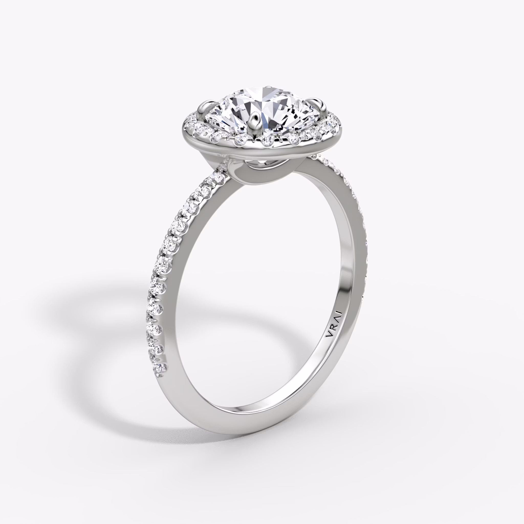 The Halo | Round Brilliant | Platinum | bandAccent: Pavé | caratWeight: 1.0ct | haloSize: original | diamondOrientation: vertical