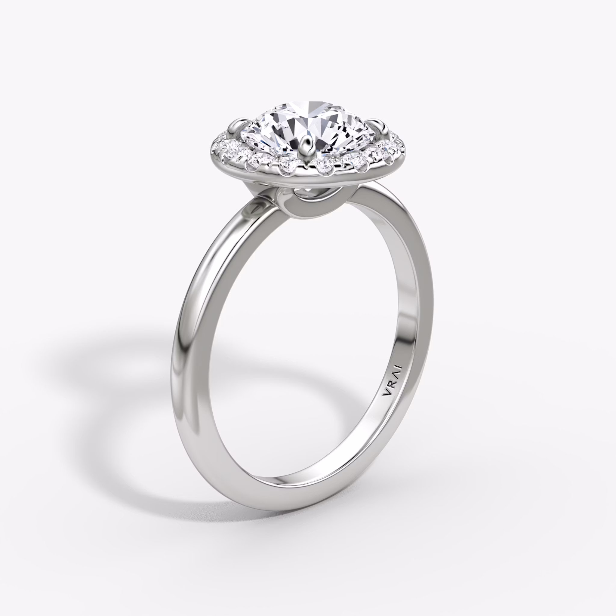 The Halo | Round Brilliant | 18k | White Gold | bandAccent: Plain | caratWeight: other | haloSize: large | diamondOrientation: vertical