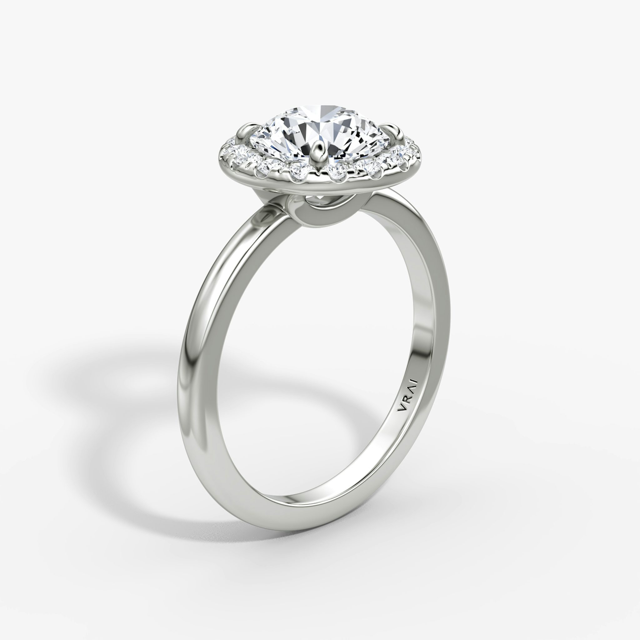 The Halo | Round Brilliant | 18k | White Gold | bandAccent: Plain | caratWeight: other | haloSize: large | diamondOrientation: vertical