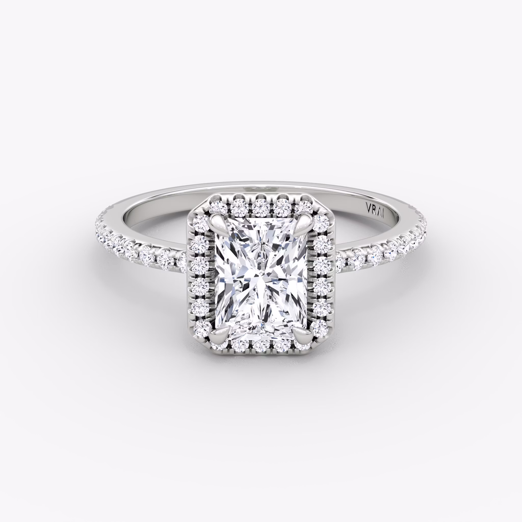 The Halo | Radiant | Platinum | bandAccent: Pavé | haloSize: original | diamondOrientation: vertical | caratWeight: other