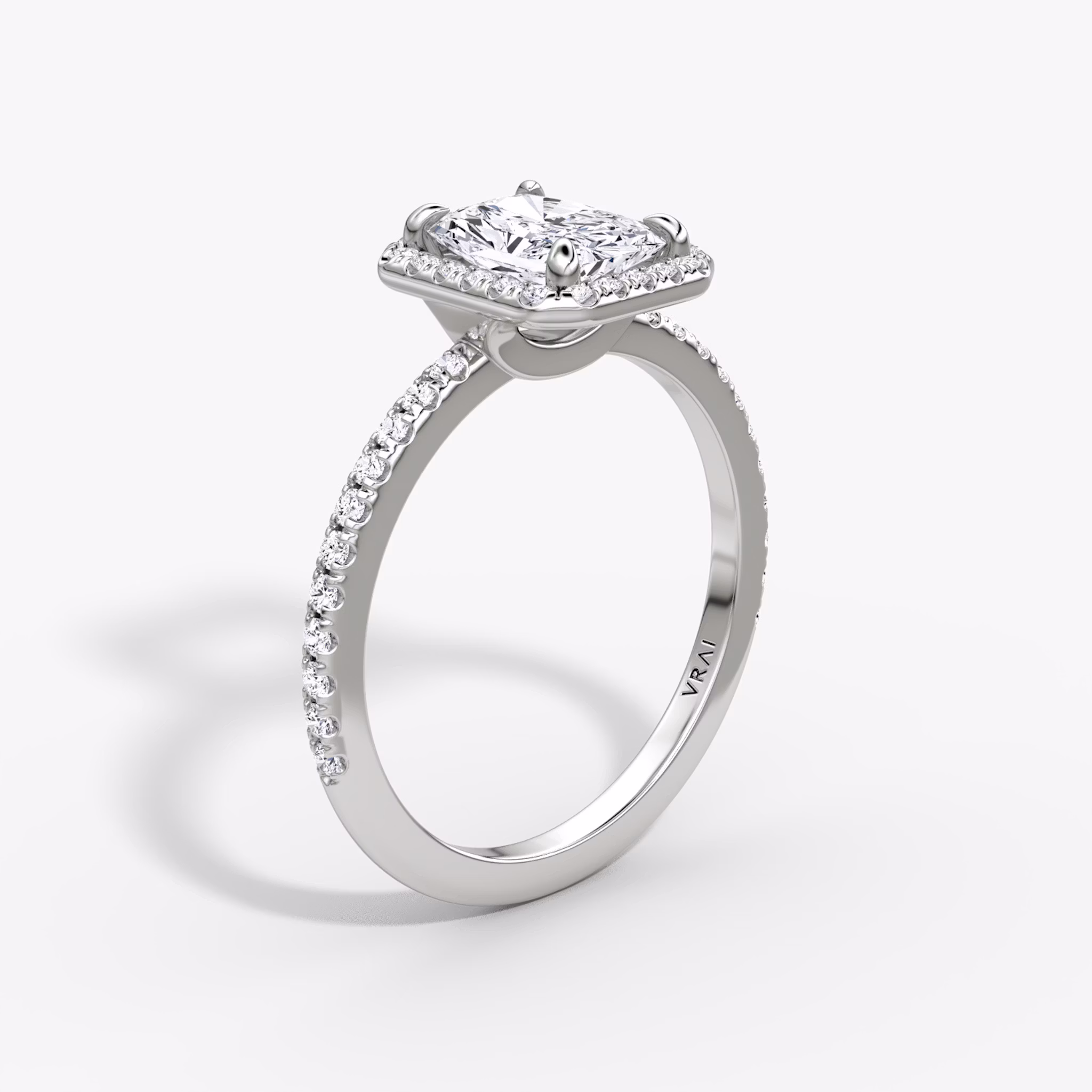 The Halo | Radiant | Platinum | bandAccent: Pavé | haloSize: original | diamondOrientation: vertical | caratWeight: other